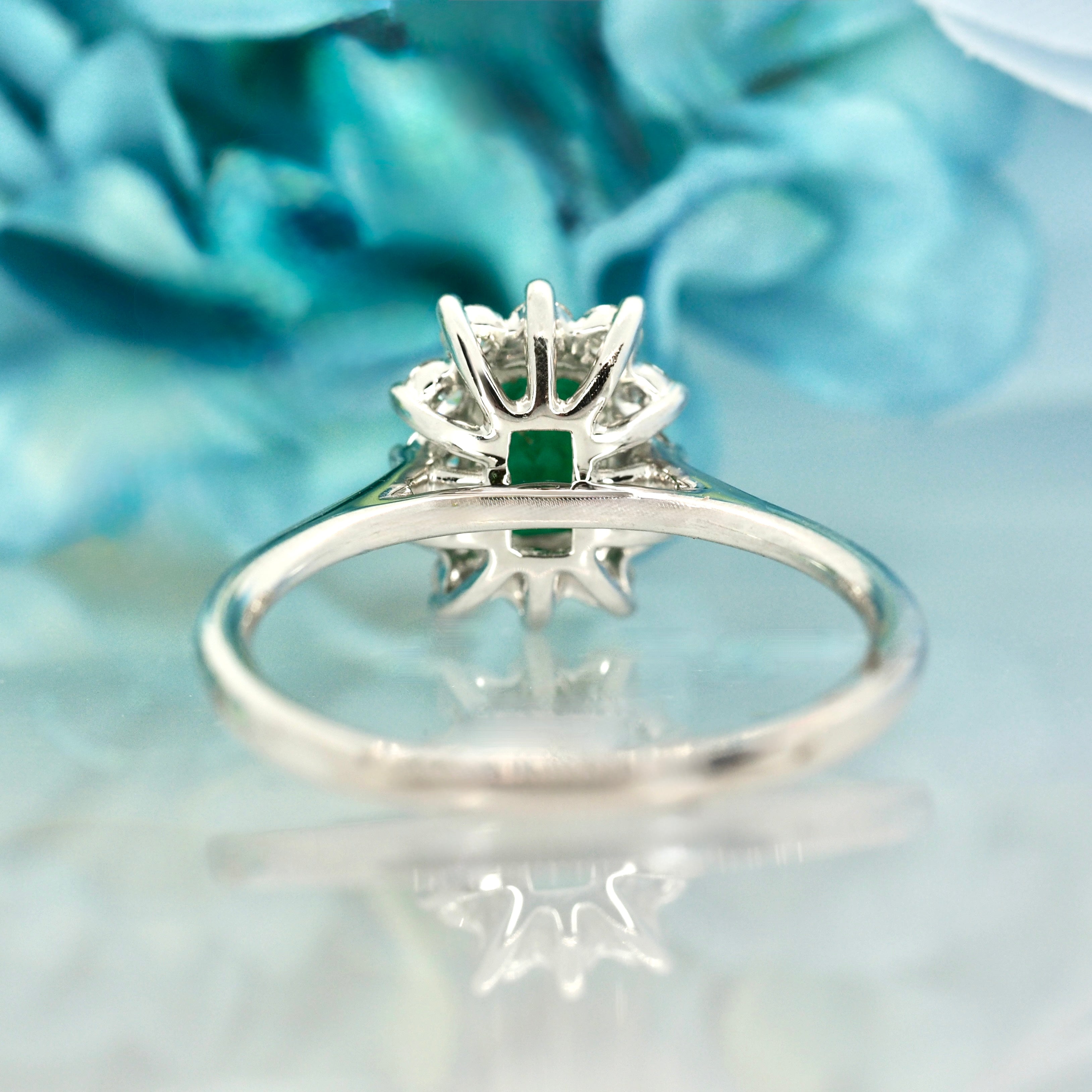 Platinum Rectangular Cut Emerald & Round Brilliant Cut Diamond Cluster Ring