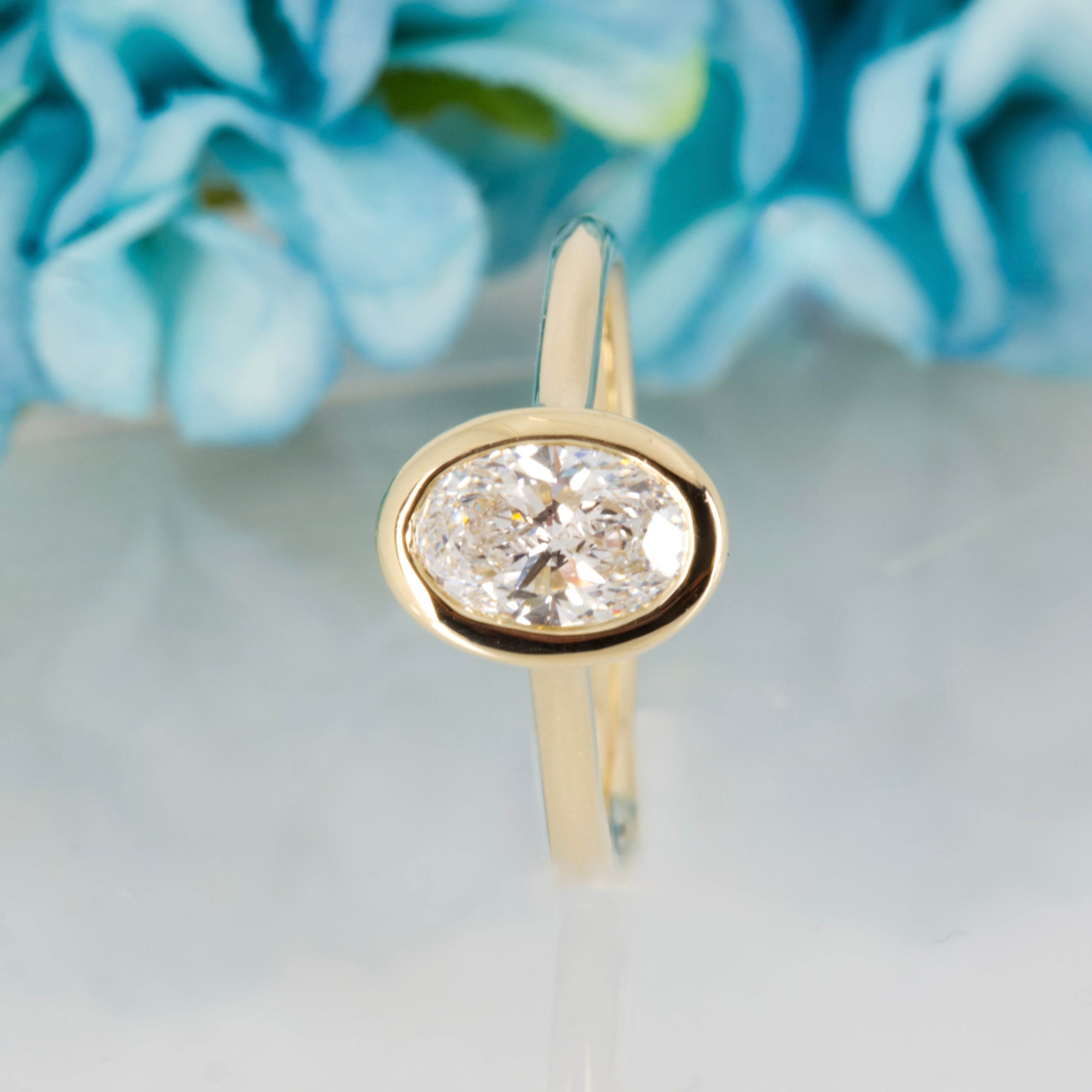 9ct Yellow Gold 1.00ct Oval Cut Lab Grown Diamond Bezel Set Solitaire Ring
