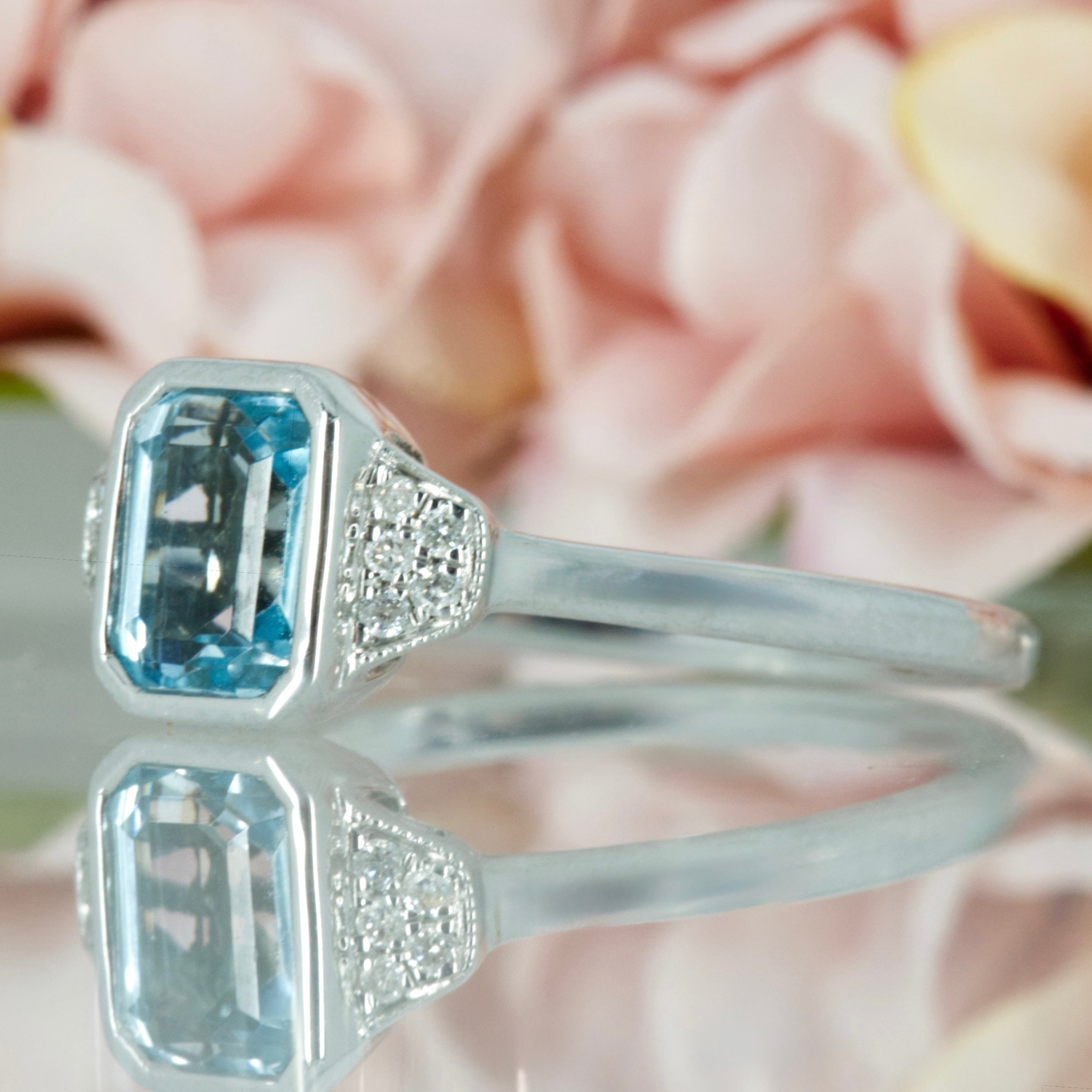9ct White Gold Octagonal Cut Blue Topaz & Round Brilliant Cut Diamond Ring