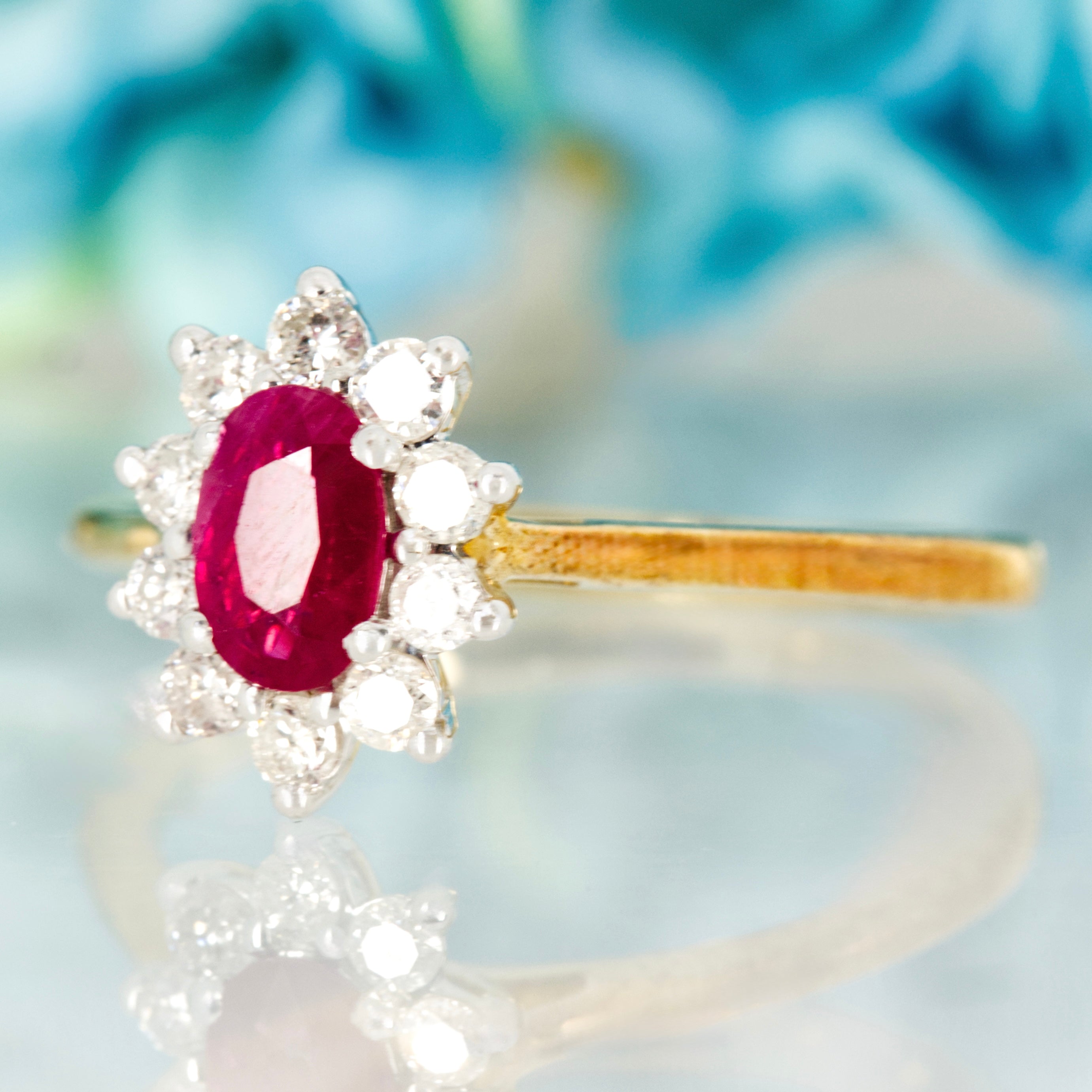 9ct Yellow Gold Oval Cut Ruby & Round Brilliant Cut Diamond Cluster Ring