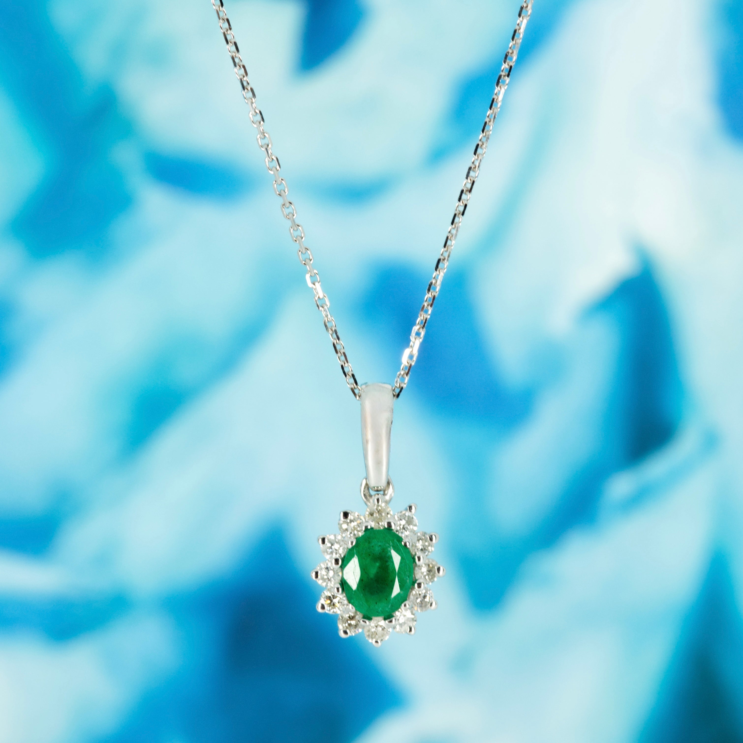 9ct White Gold Oval Cut Emerald & Round Brilliant Cut Diamond Cluster Pendant & Chain