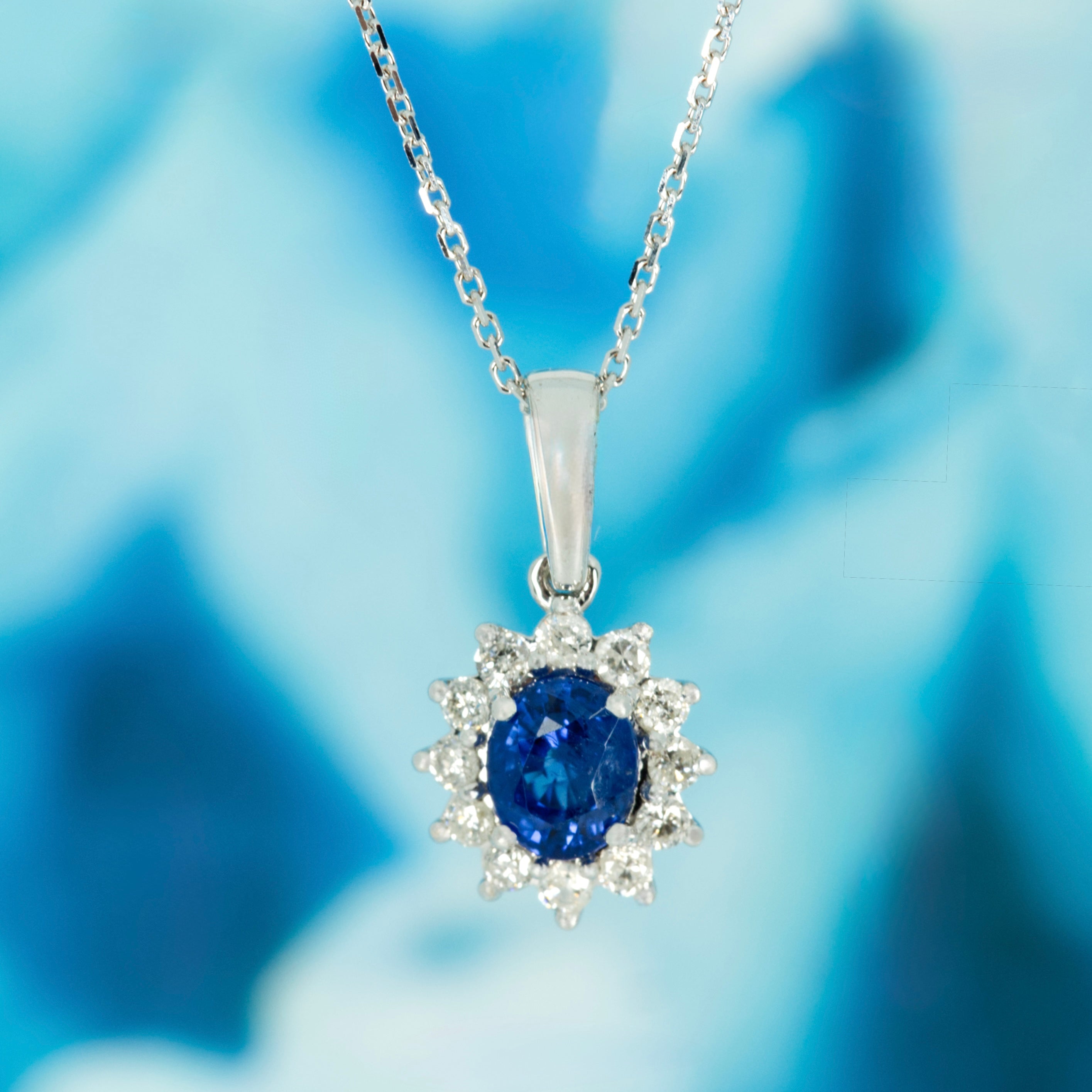 9ct White Gold Oval Cut Sapphire & Round Brilliant Cut Diamond Cluster Pendant & Chain