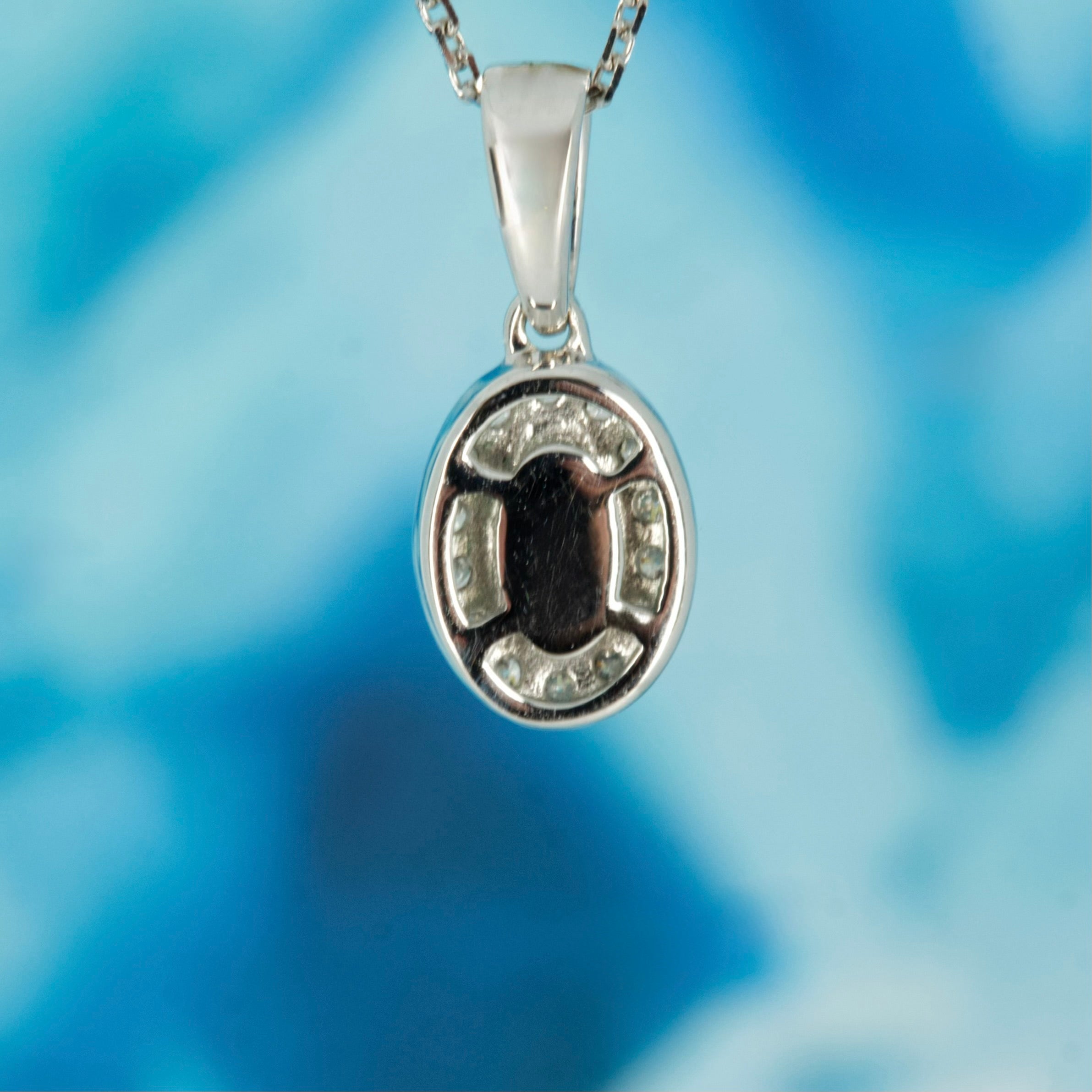 9ct White Gold Oval Cut Emerald & Round Brilliant Cut Diamond Halo Cluster Pendant & Chain
