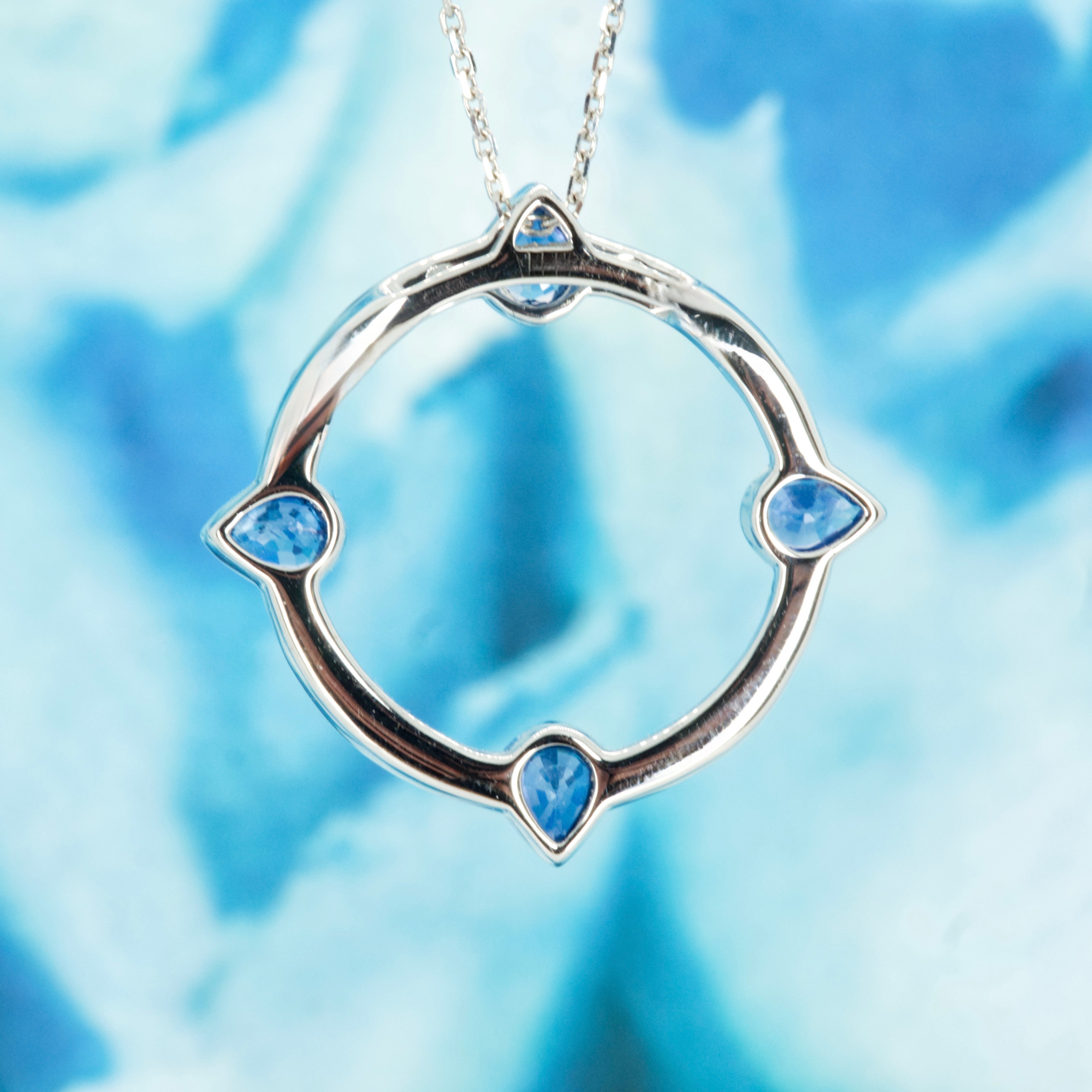18ct White Gold Pear Cut Sapphire & Round Brilliant Cut Diamond Circle Pendant & Chain