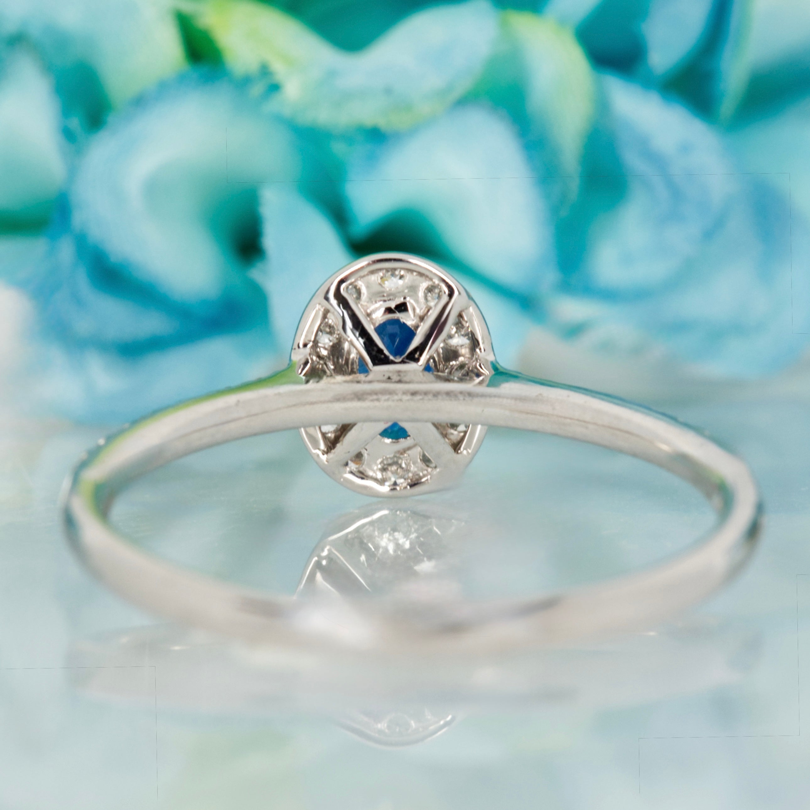 Platinum Oval Cut Sapphire & Round Brilliant Cut Diamond Halo Cluster Ring