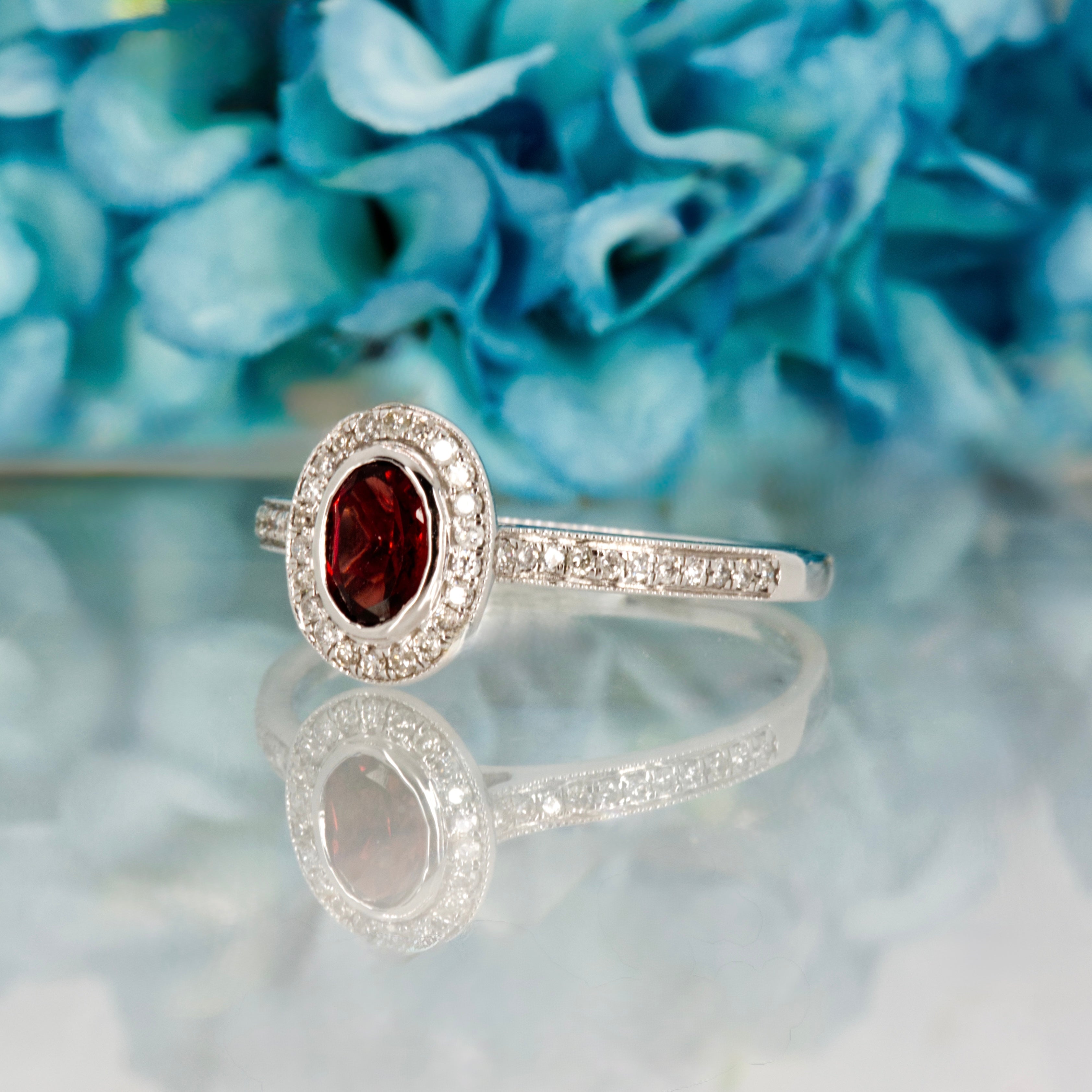 18ct White Gold Oval Cut Garnet & Round Brilliant Cut Diamond Halo Cluster Ring