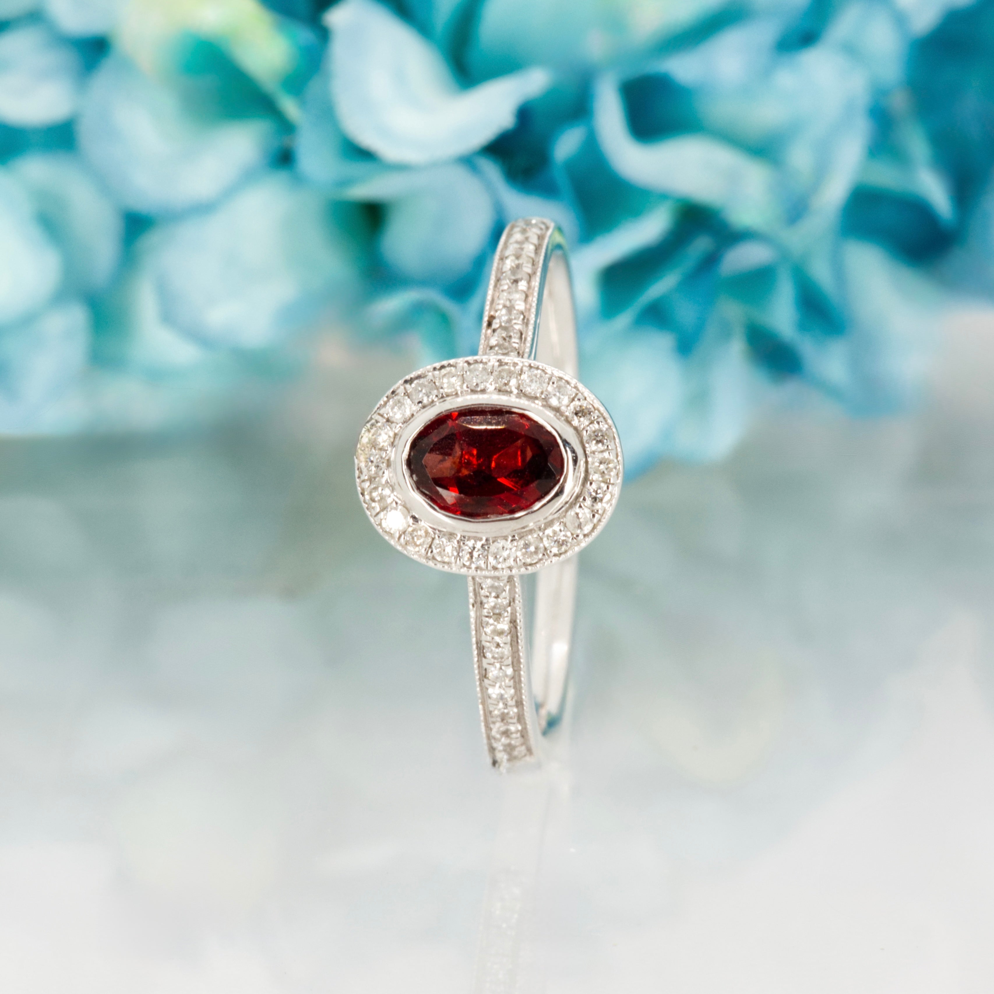 18ct White Gold Oval Cut Garnet & Round Brilliant Cut Diamond Halo Cluster Ring