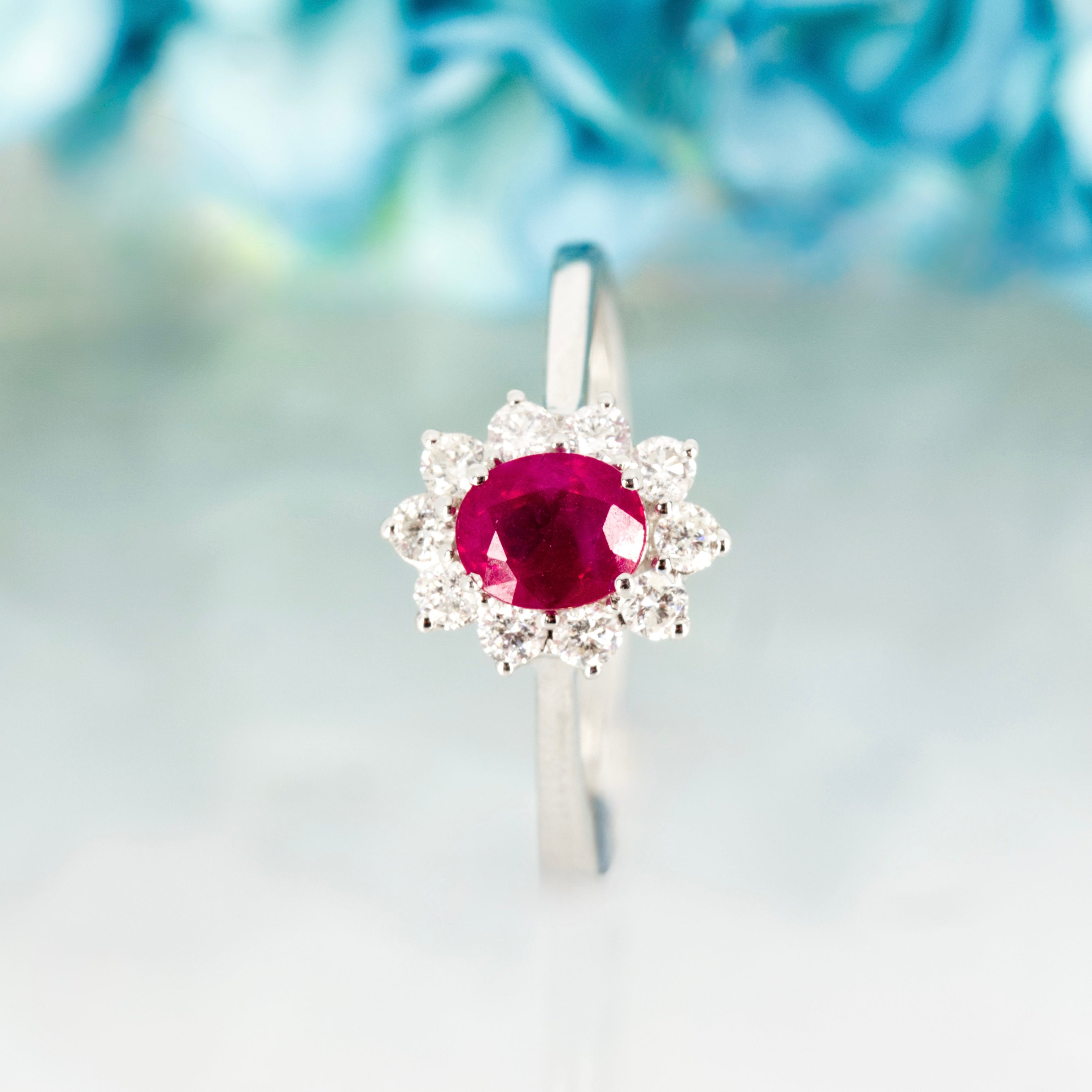 18ct White Gold Oval Cut Ruby & Round Brilliant Cut Diamond Cluster Ring
