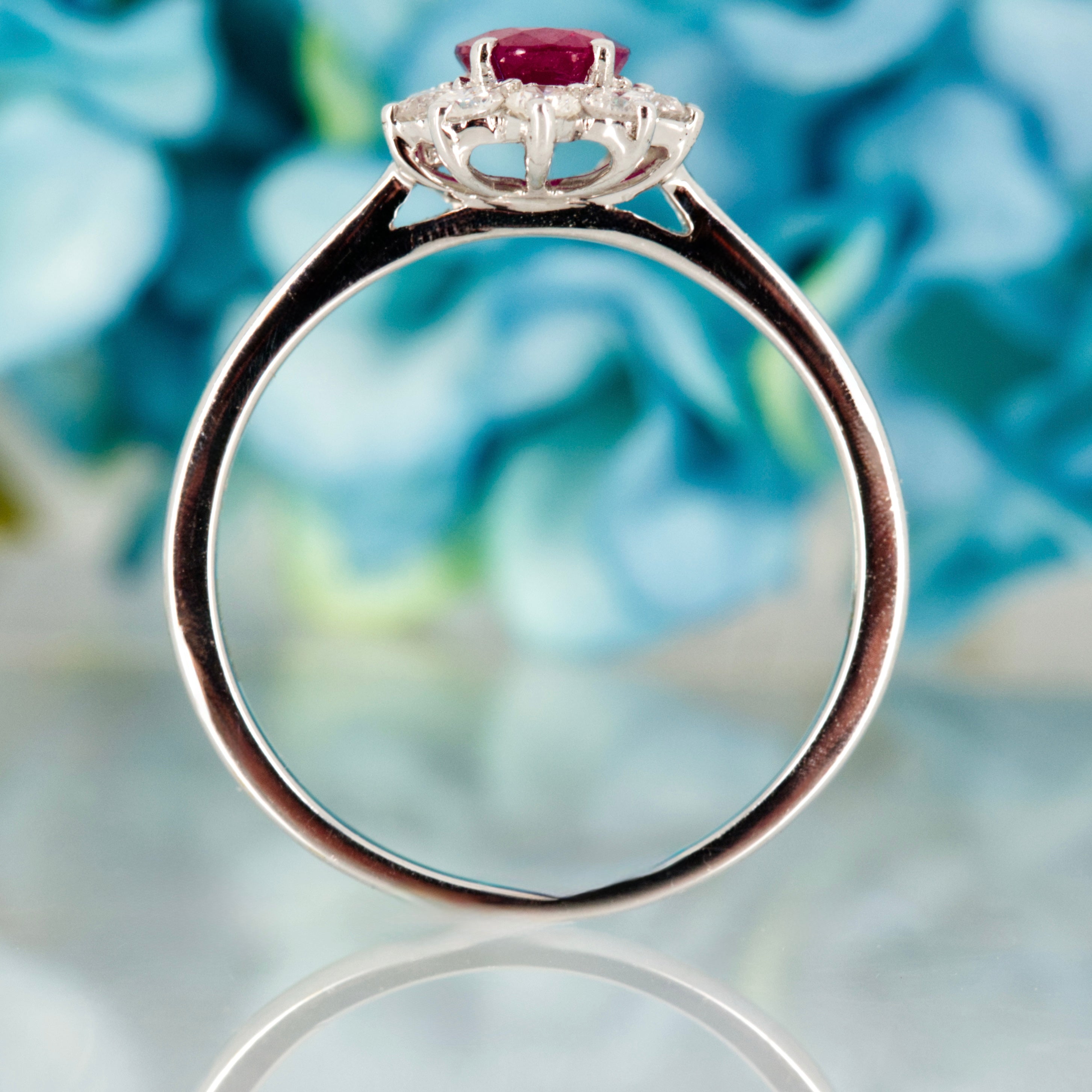 18ct White Gold Oval Cut Ruby & Round Brilliant Cut Diamond Cluster Ring
