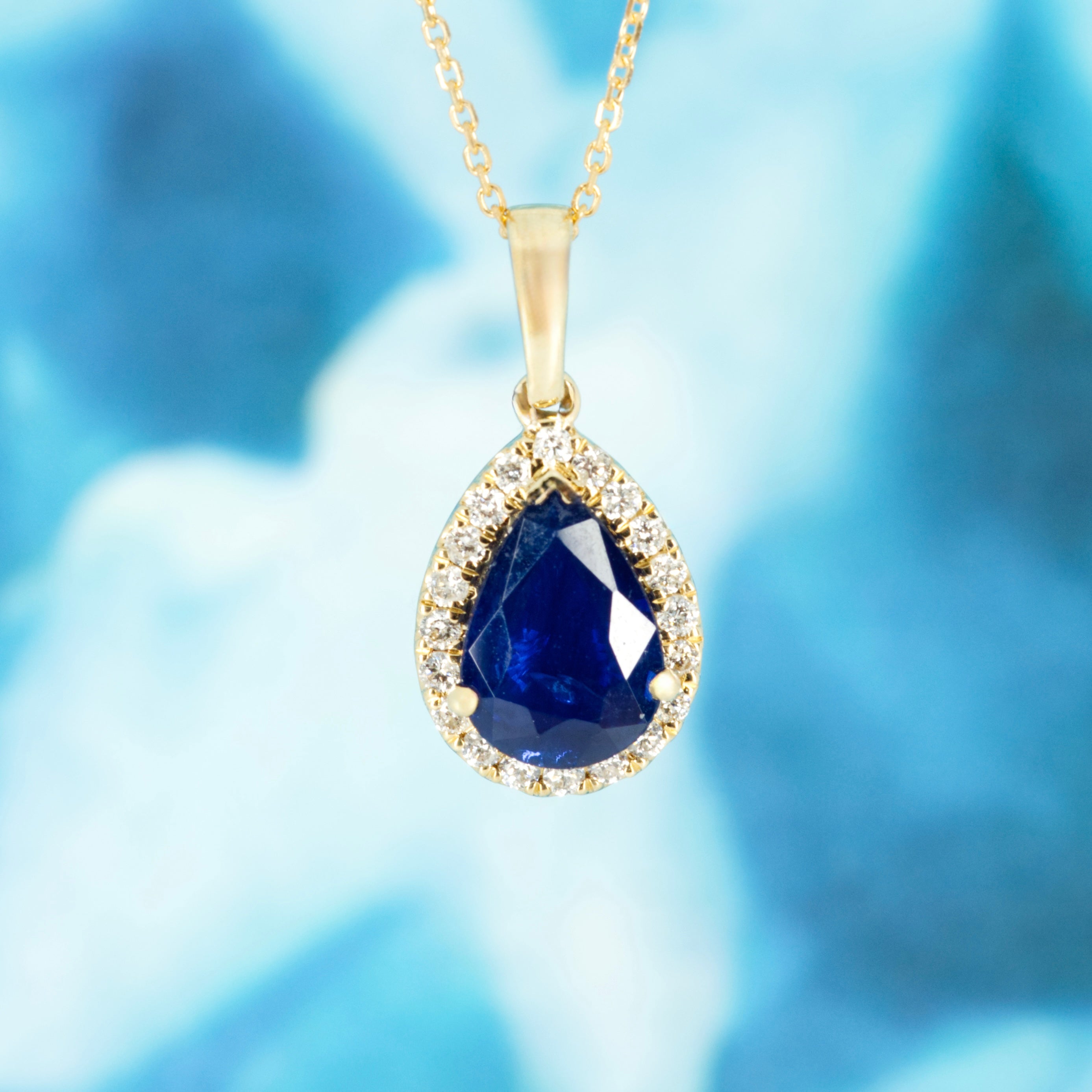 9ct Yellow Gold Pear Cut Sapphire & Round Brilliant Cut Diamond Halo Cluster Pendant & Chain