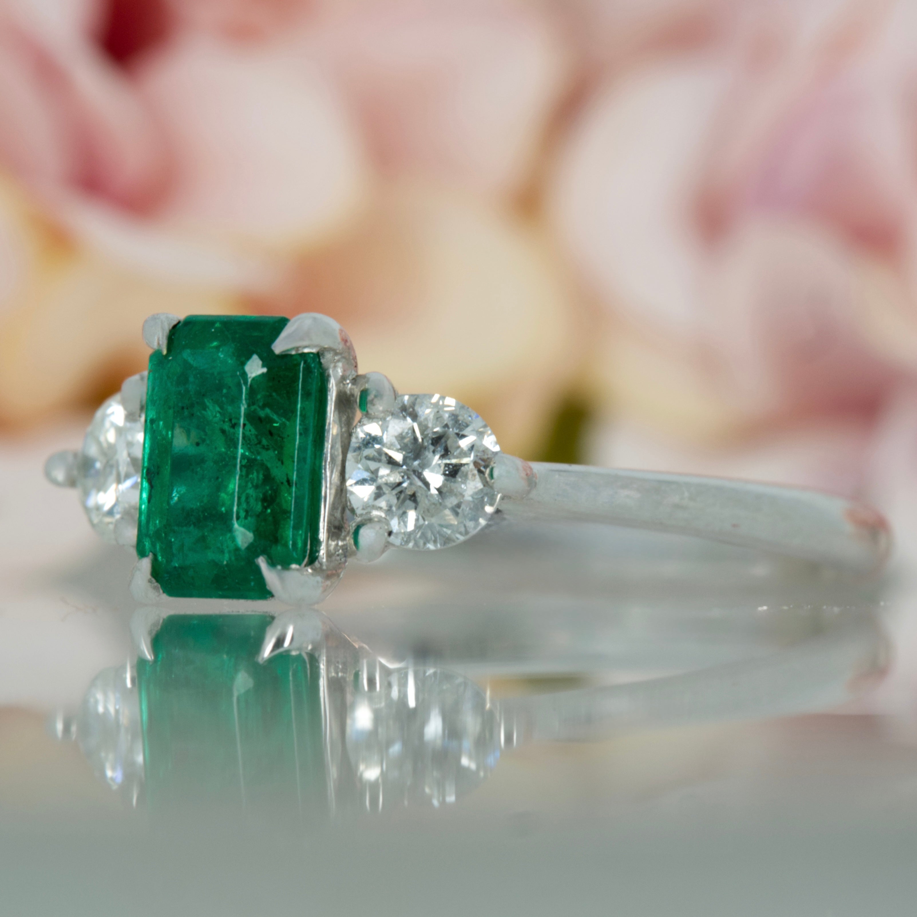 Platinum Octagonal Cut Emerald & Round Brilliant Cut Diamond Trilogy Ring