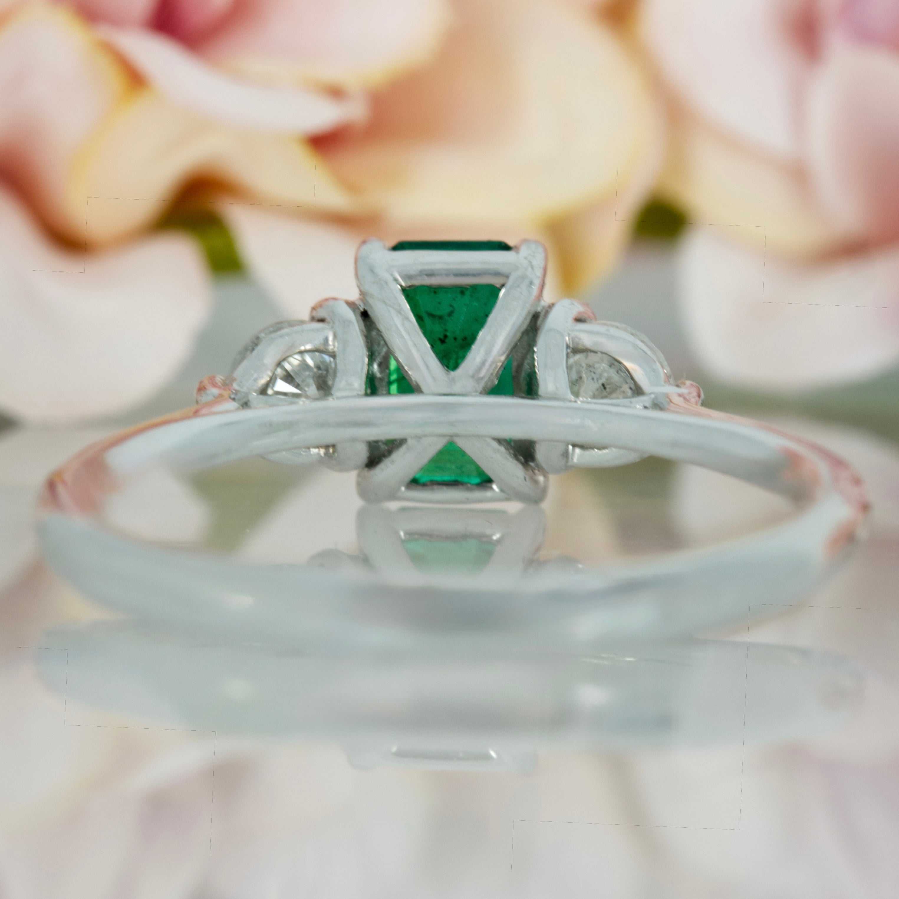 Platinum Octagonal Cut Emerald & Round Brilliant Cut Diamond Trilogy Ring