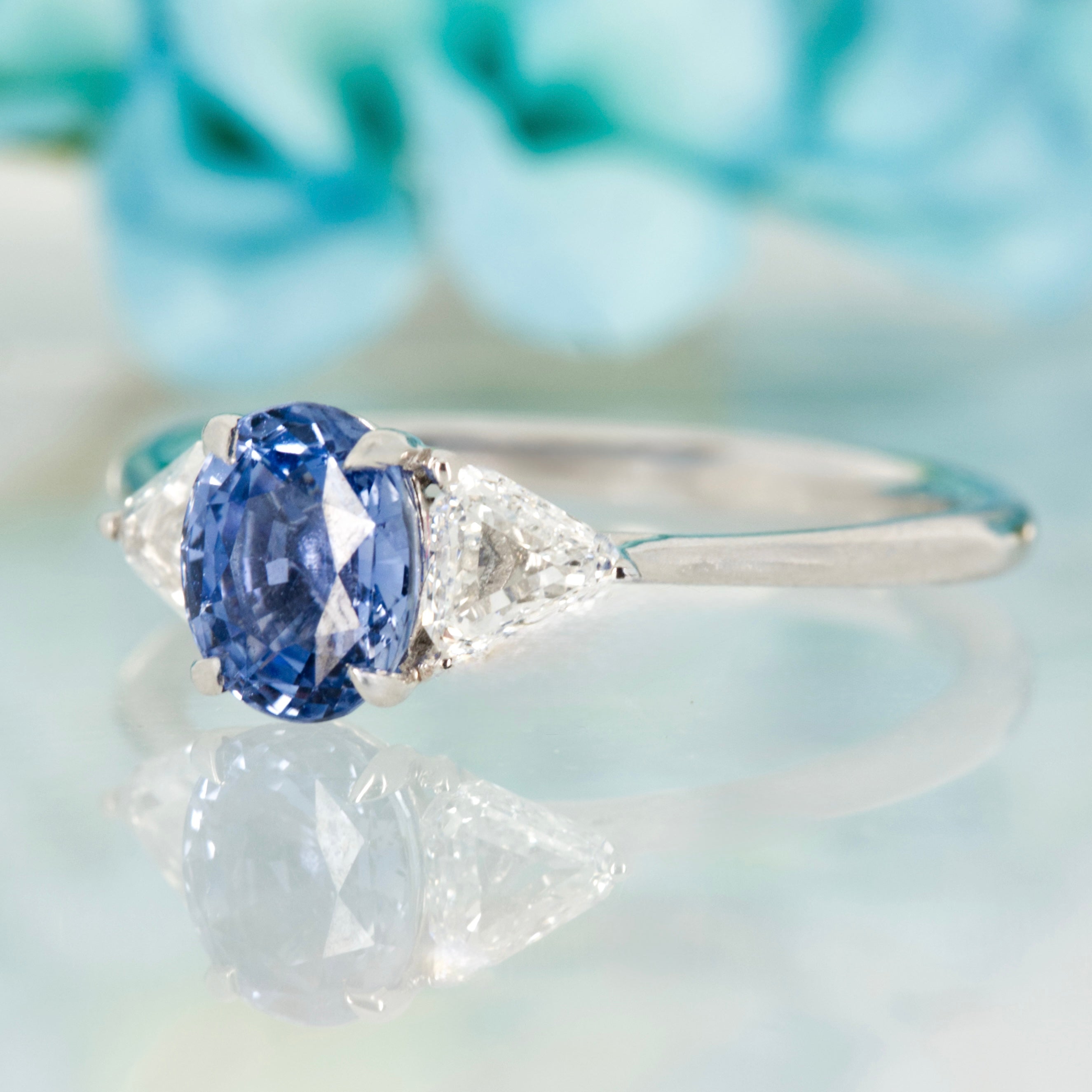 Platinum Oval Cut Sapphire & Trilliant Cut Diamond Trilogy Ring