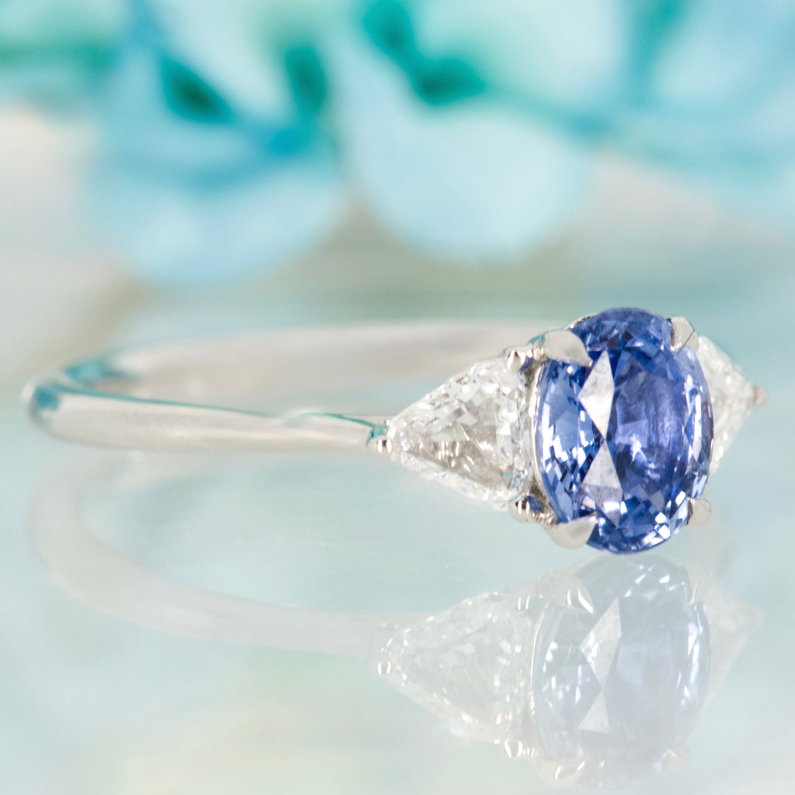 Platinum Oval Cut Sapphire & Trilliant Cut Diamond Trilogy Ring