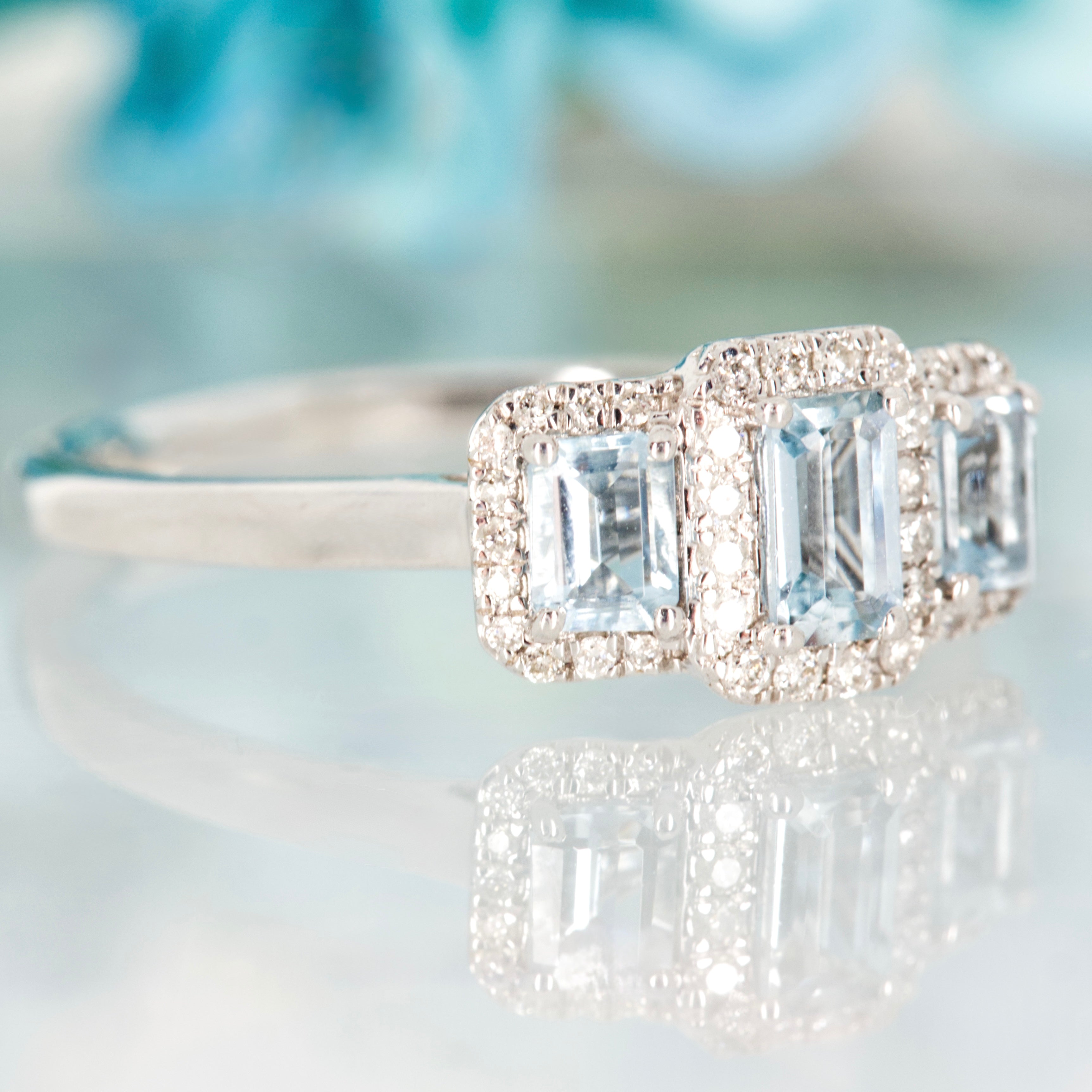 9ct White Gold Octagonal Cut Aquamarine & Round Brilliant Cut Diamond Triple Cluster Ring