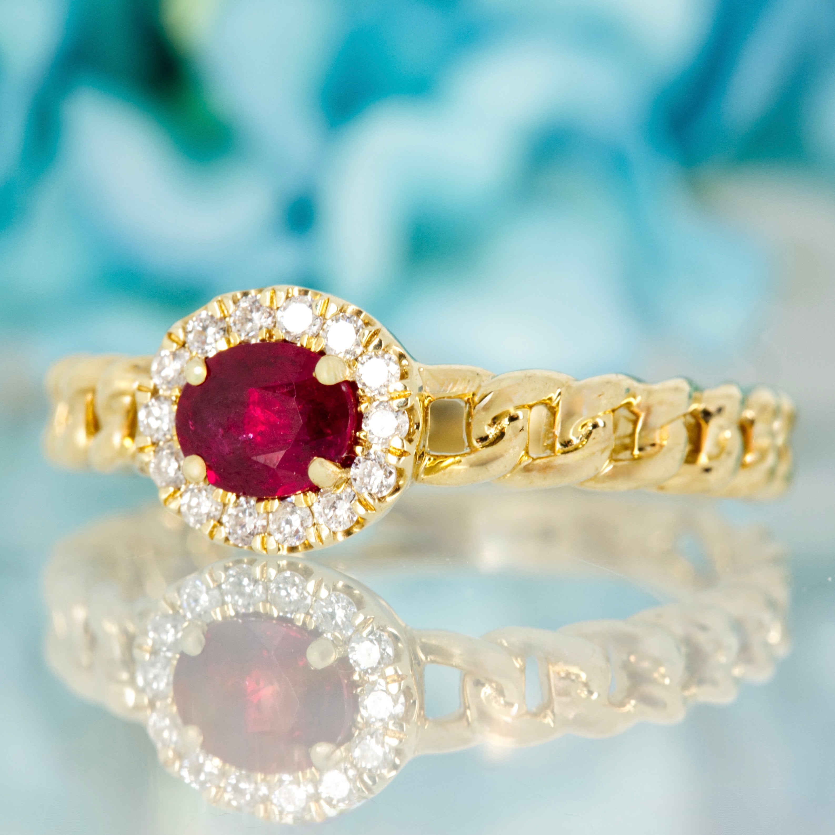 9ct Yellow Gold Oval Cut Ruby & Round Brilliant Cut Diamond Horizontal Halo Cluster Ring