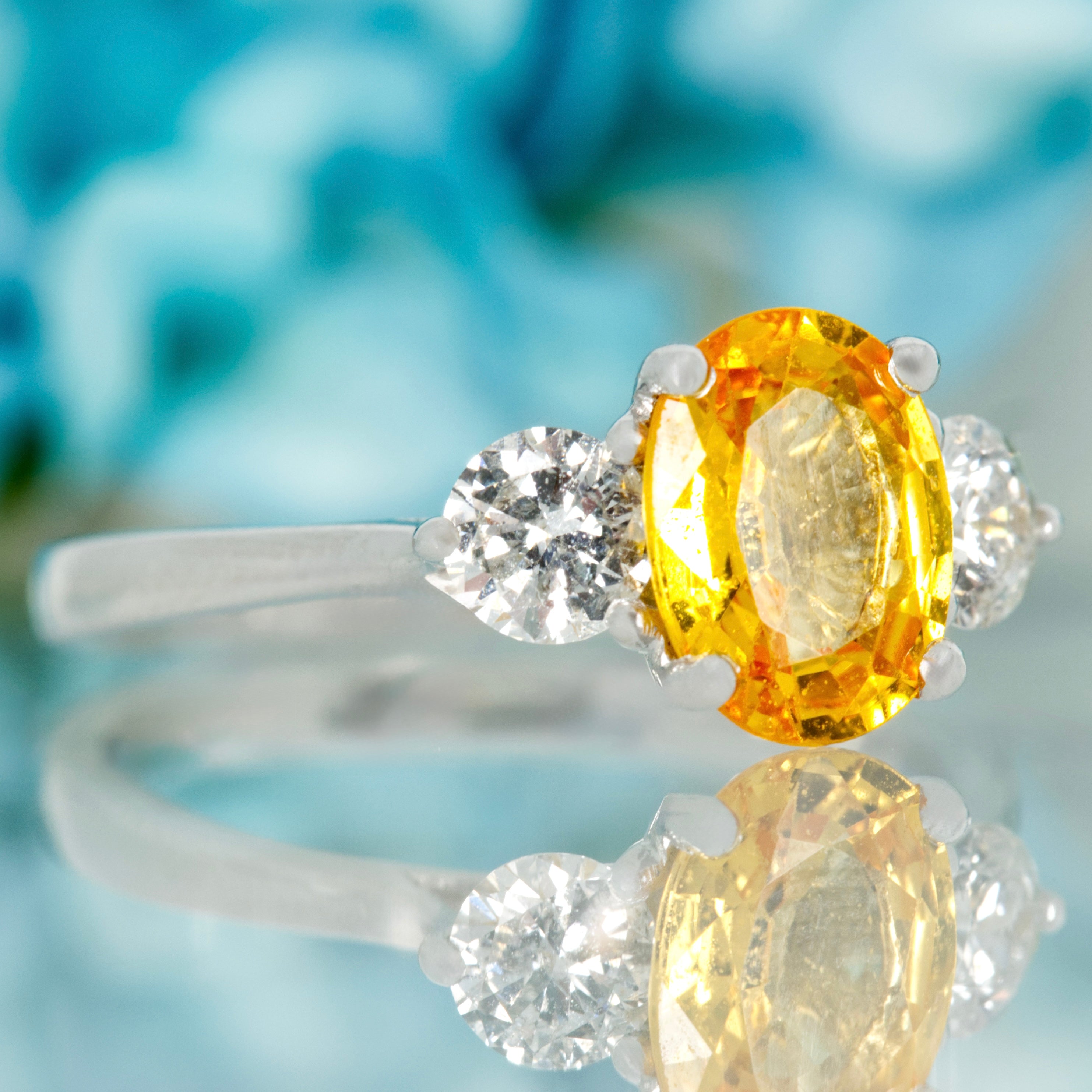 Platinum Oval Cut Yellow Sapphire & Round Brilliant Cut Diamond Trilogy Ring