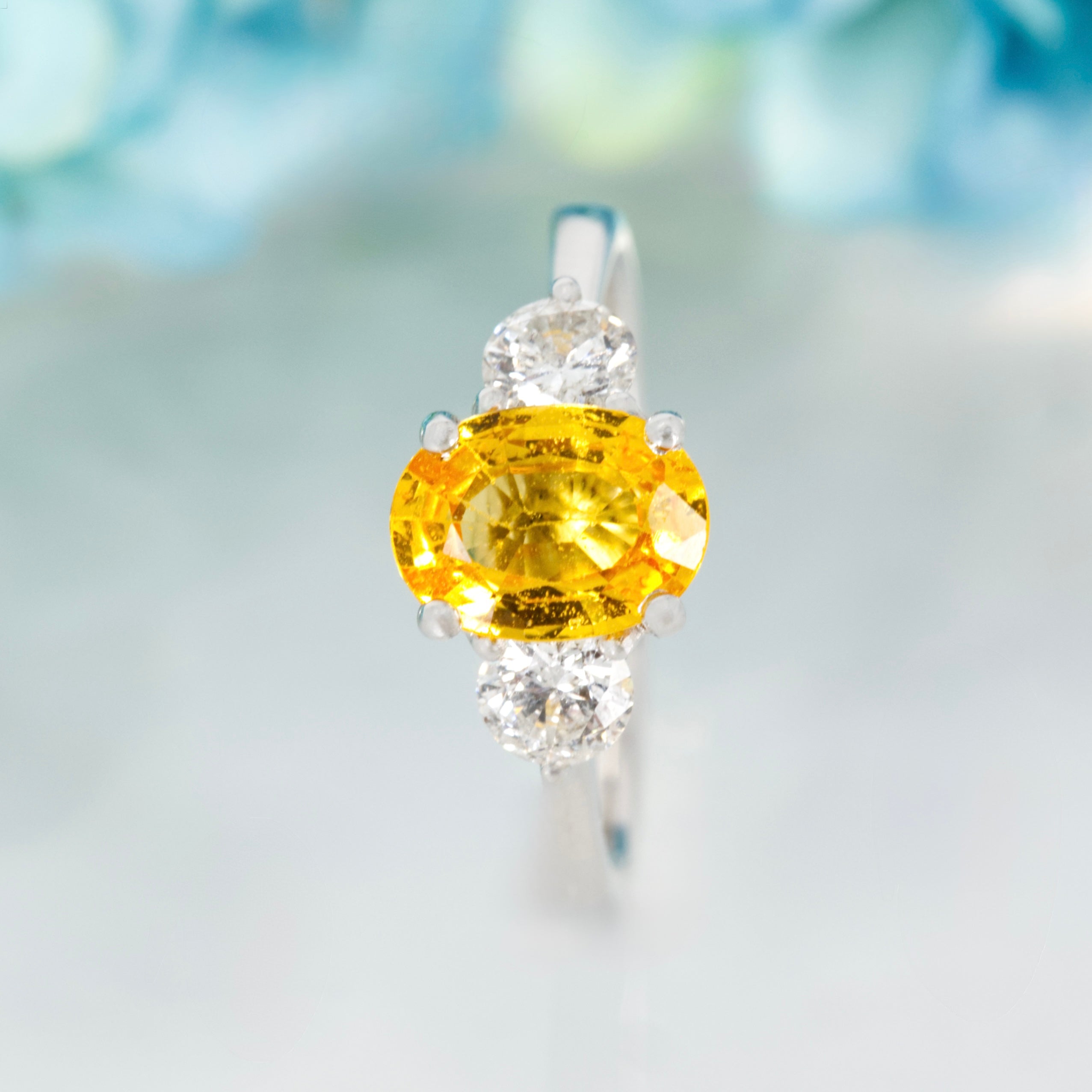 Platinum Oval Cut Yellow Sapphire & Round Brilliant Cut Diamond Trilogy Ring