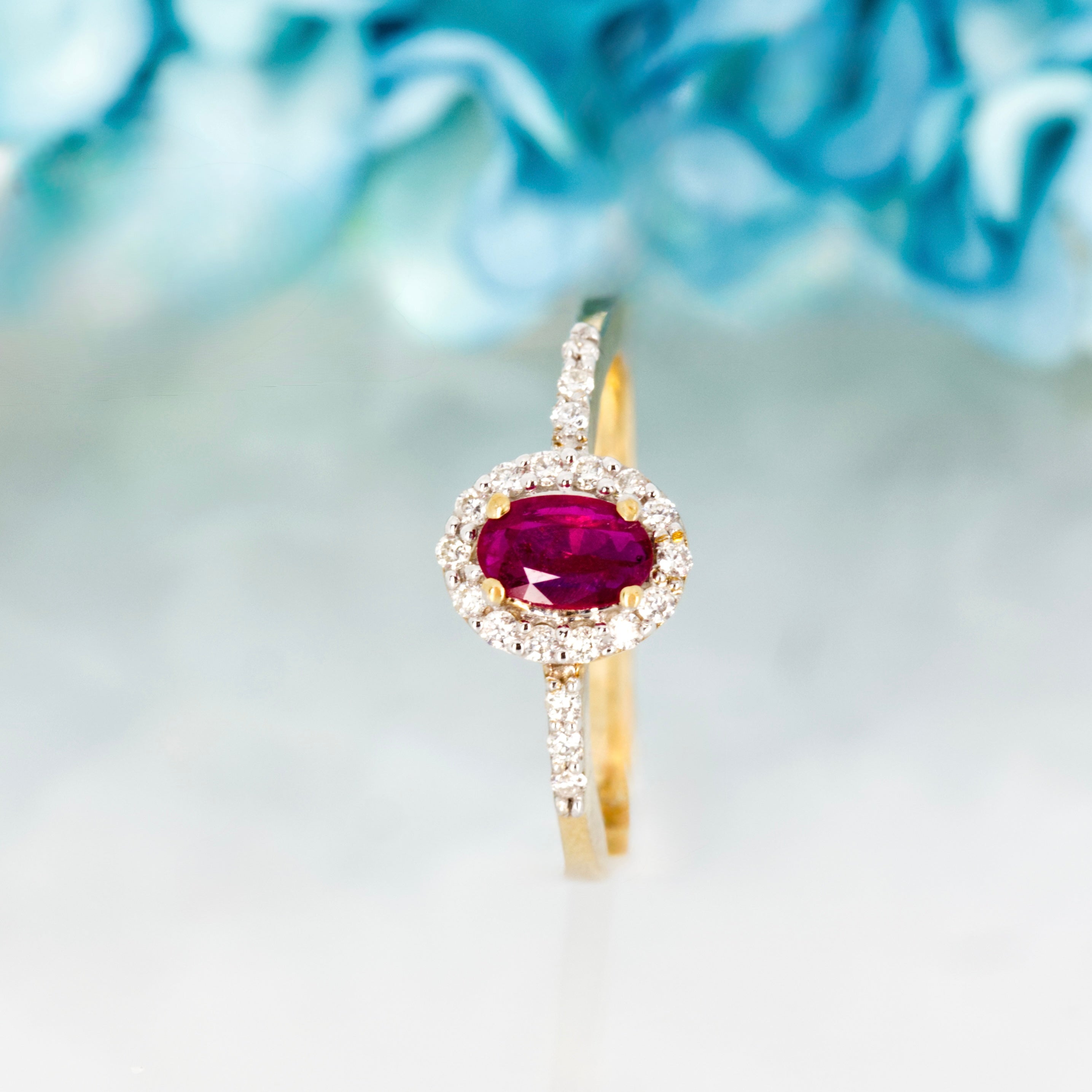 9ct Yellow Gold Oval Cut Ruby & Round Brilliant Cut Diamond Halo Cluster Ring