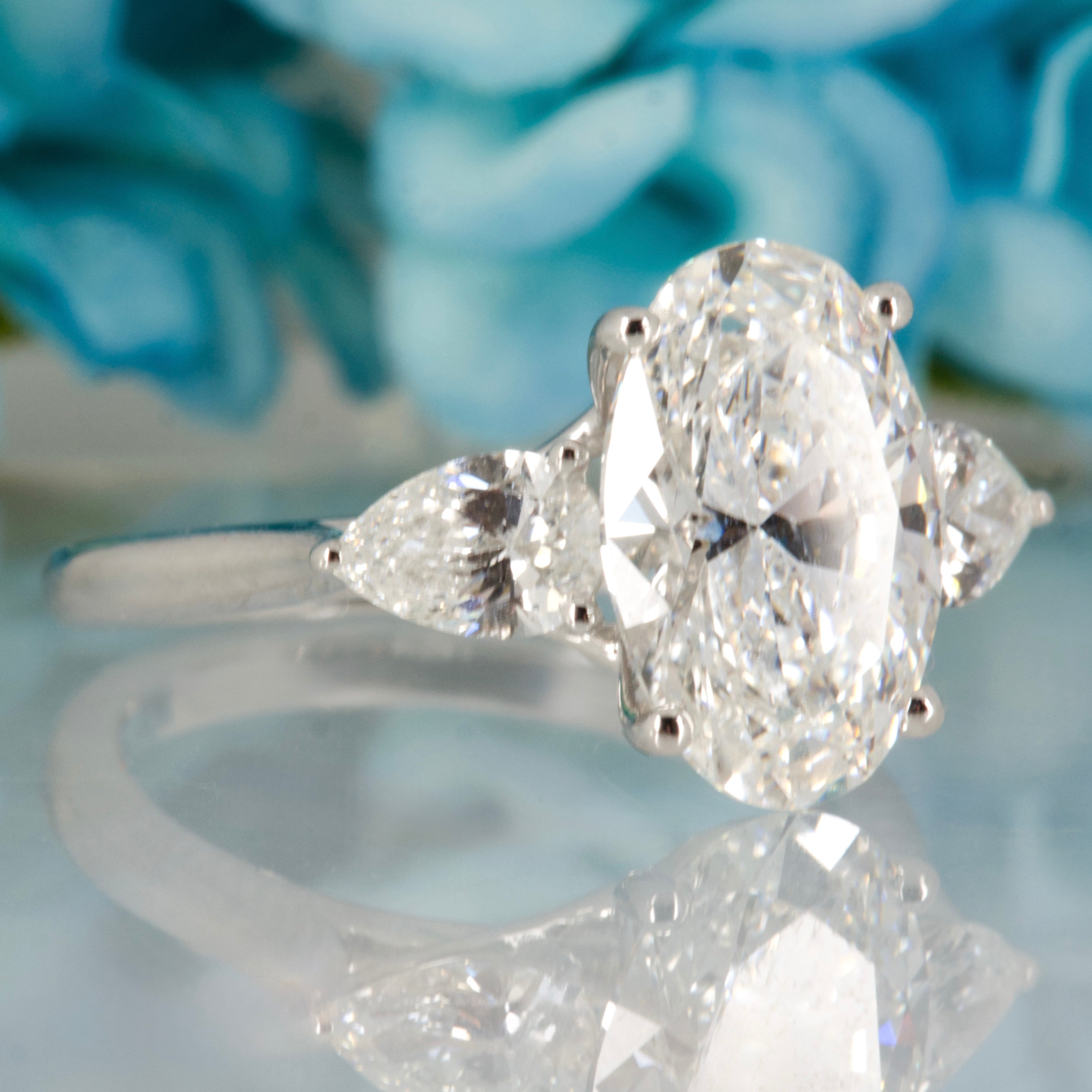 Platinum 3.69ct Oval & Pear Cut Lab Grown Diamond Trilogy Ring
