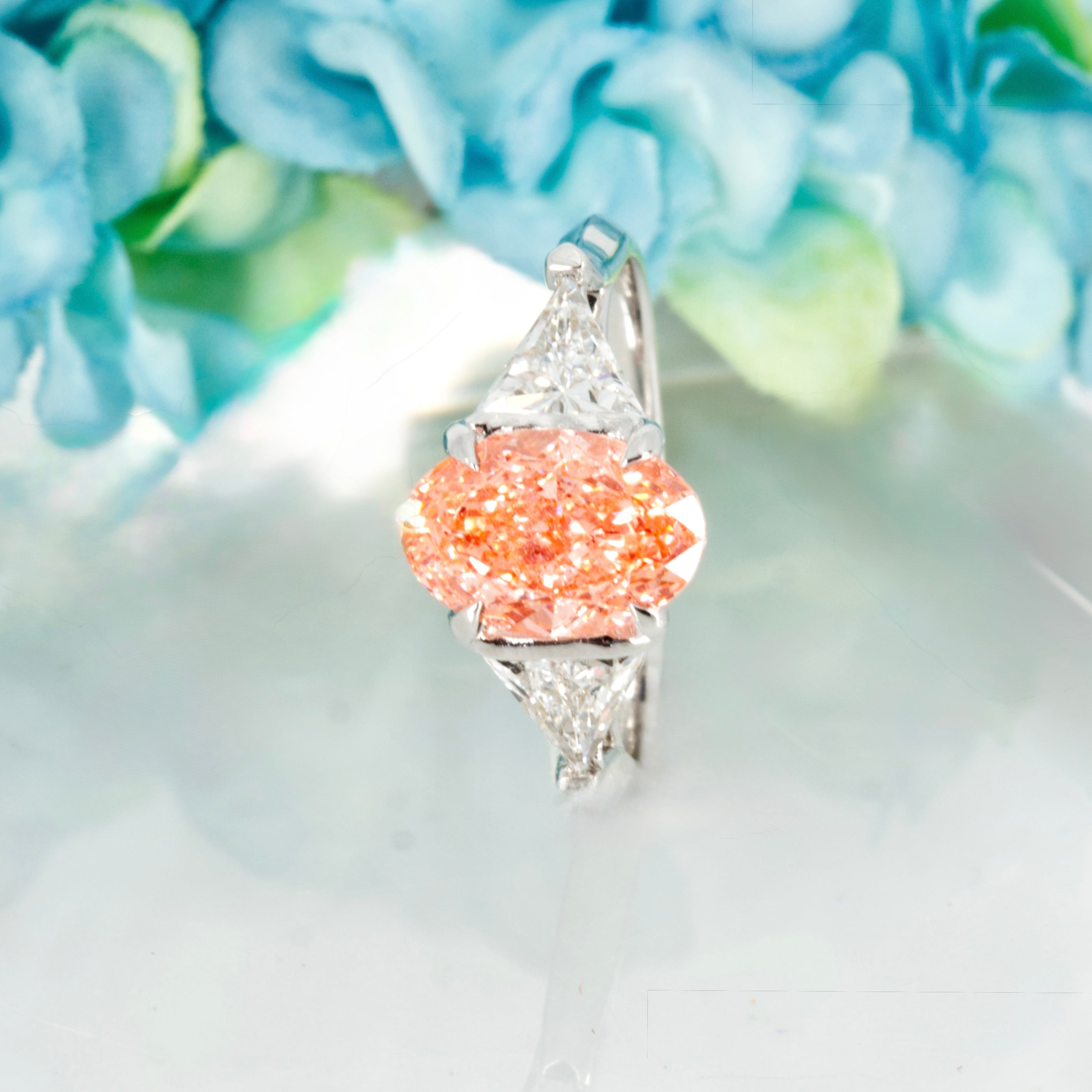 18ct White Gold Oval Cut Lab Grown Pink Diamond & Trilliant Cut Lab Grown Diamond Trilogy Ring