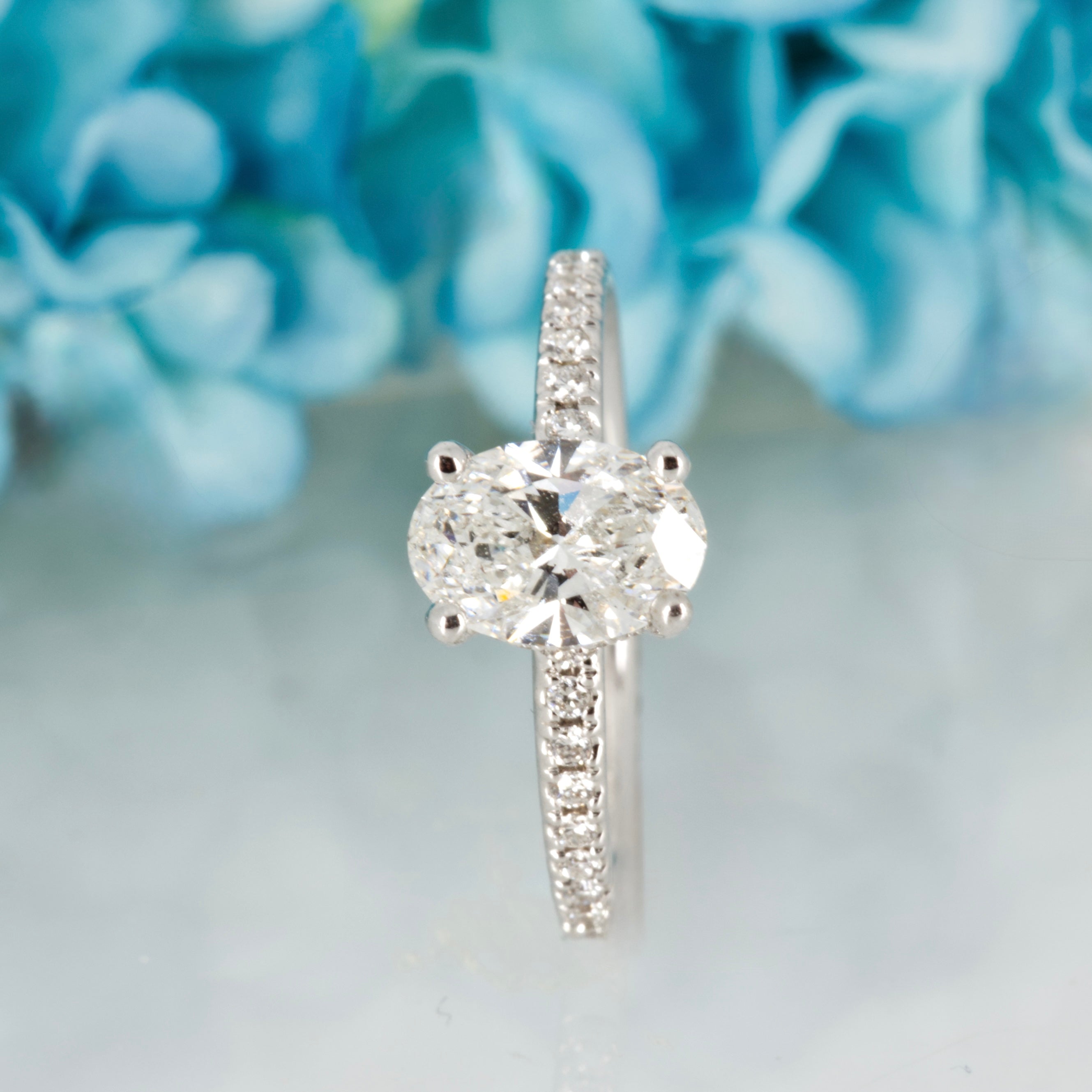 18ct White Gold 1.10ct Oval Cut Lab Grown Diamond Solitaire Ring with Lab Grown Diamond Shoulders
