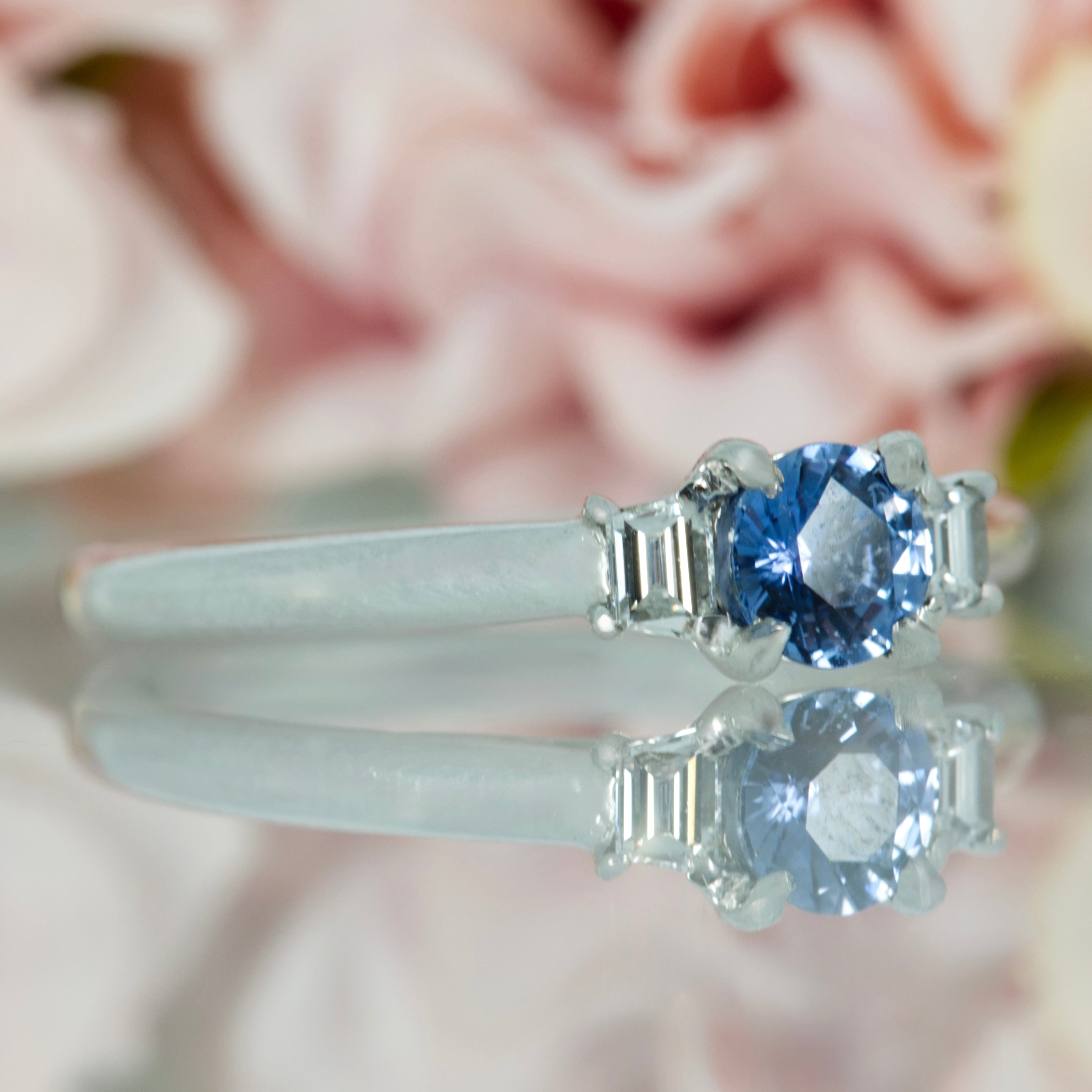 Platinum Round Cut Sapphire & Trapezoid Cut Diamond Trilogy Ring