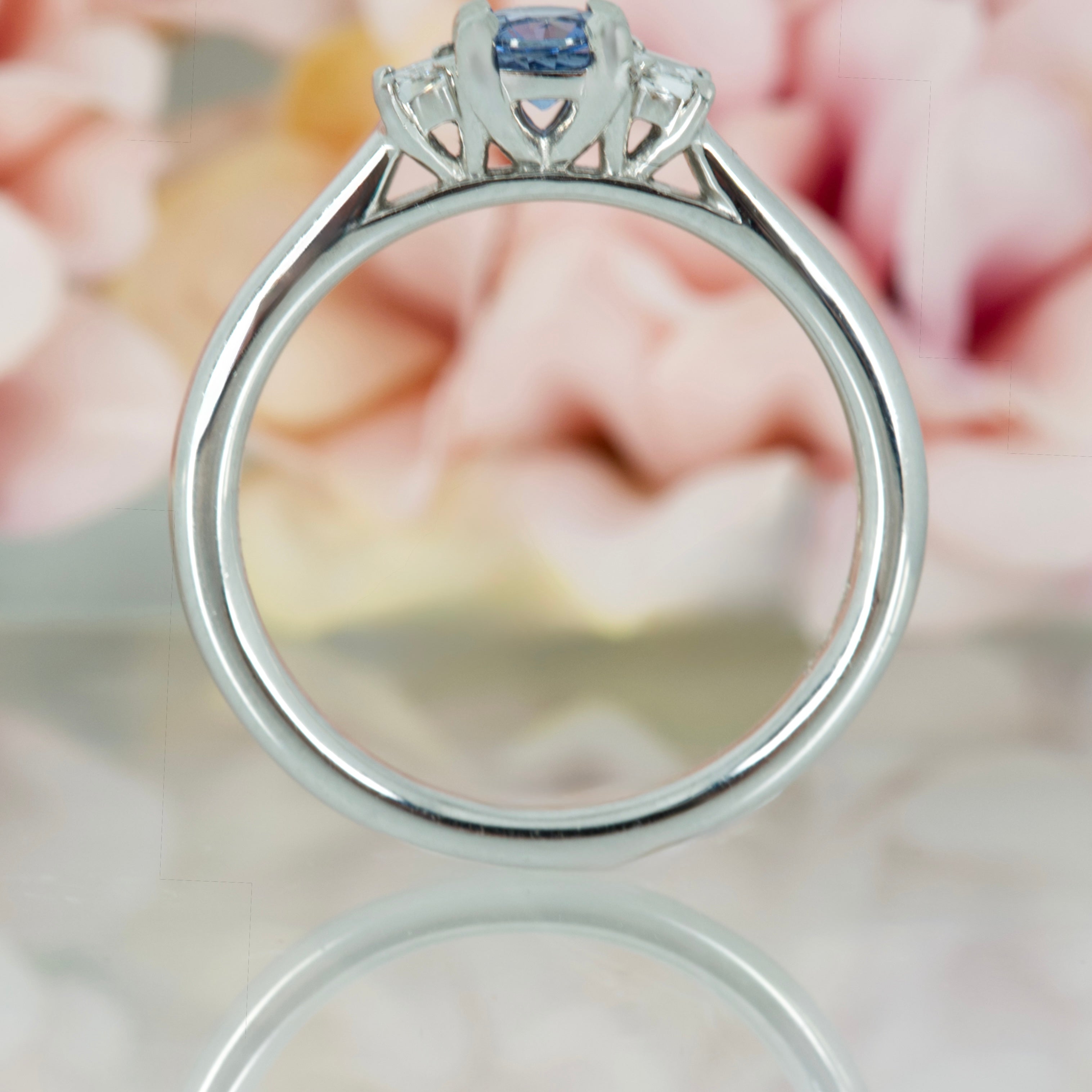 Platinum Round Cut Sapphire & Trapezoid Cut Diamond Trilogy Ring