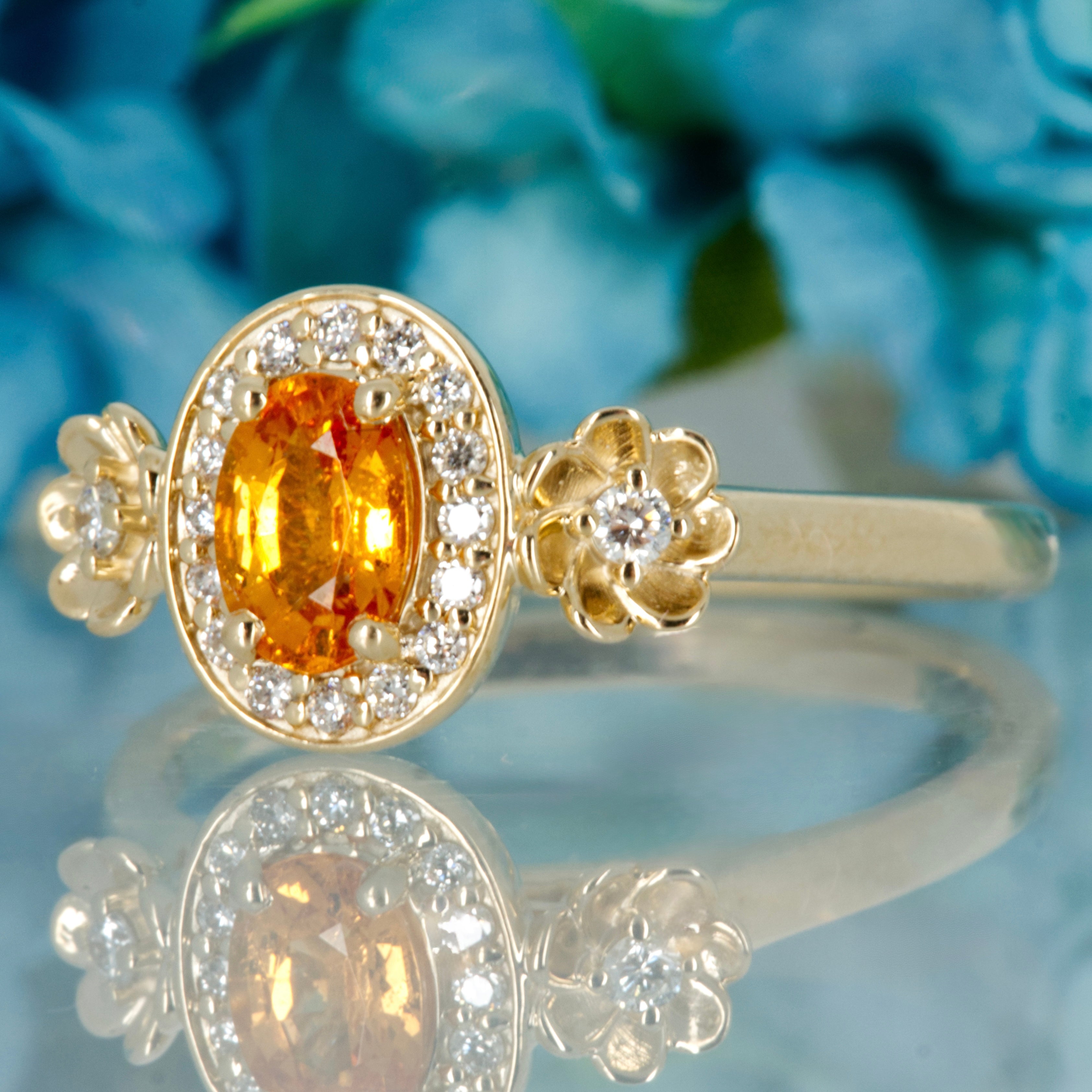 9ct Yellow Gold Oval Cut Spessartite Garnet & Round Brilliant Cut Diamond Halo Cluster Ring
