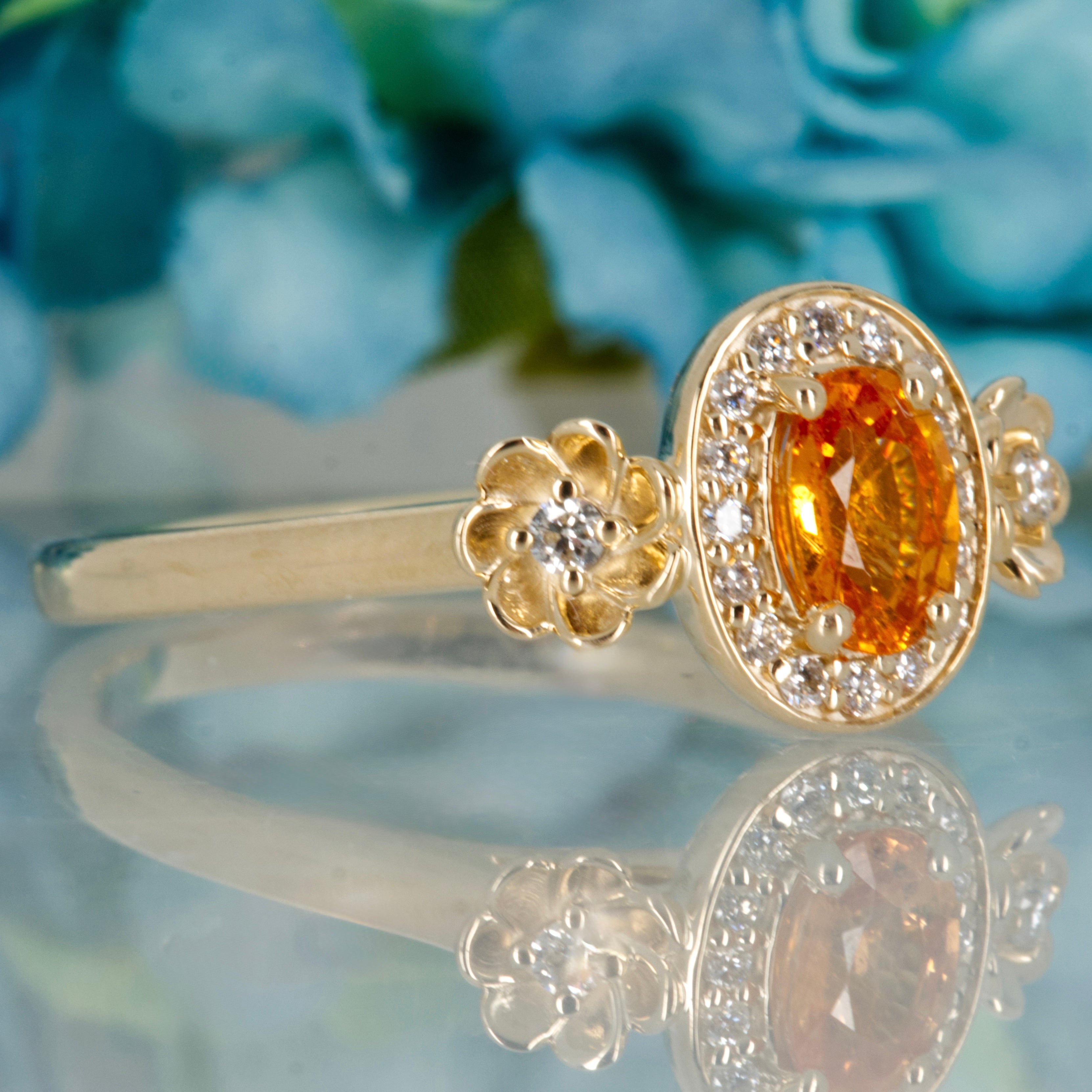 9ct Yellow Gold Oval Cut Spessartite Garnet & Round Brilliant Cut Diamond Halo Cluster Ring