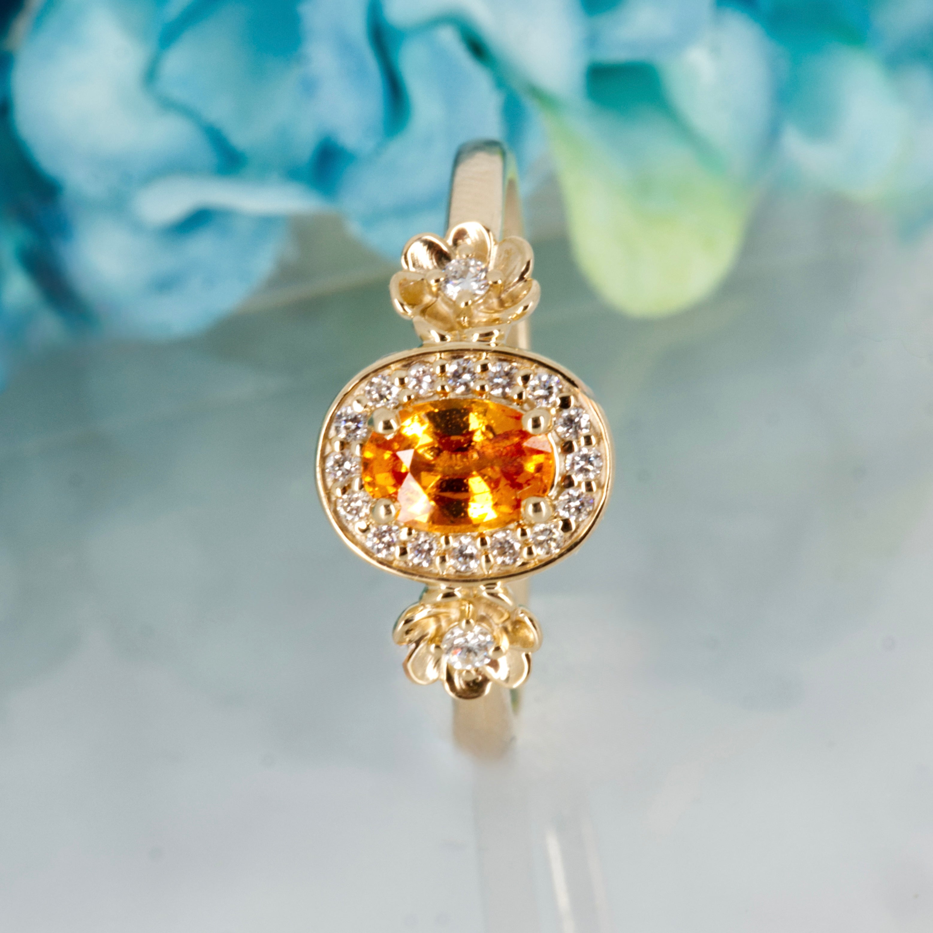 9ct Yellow Gold Oval Cut Spessartite Garnet & Round Brilliant Cut Diamond Halo Cluster Ring