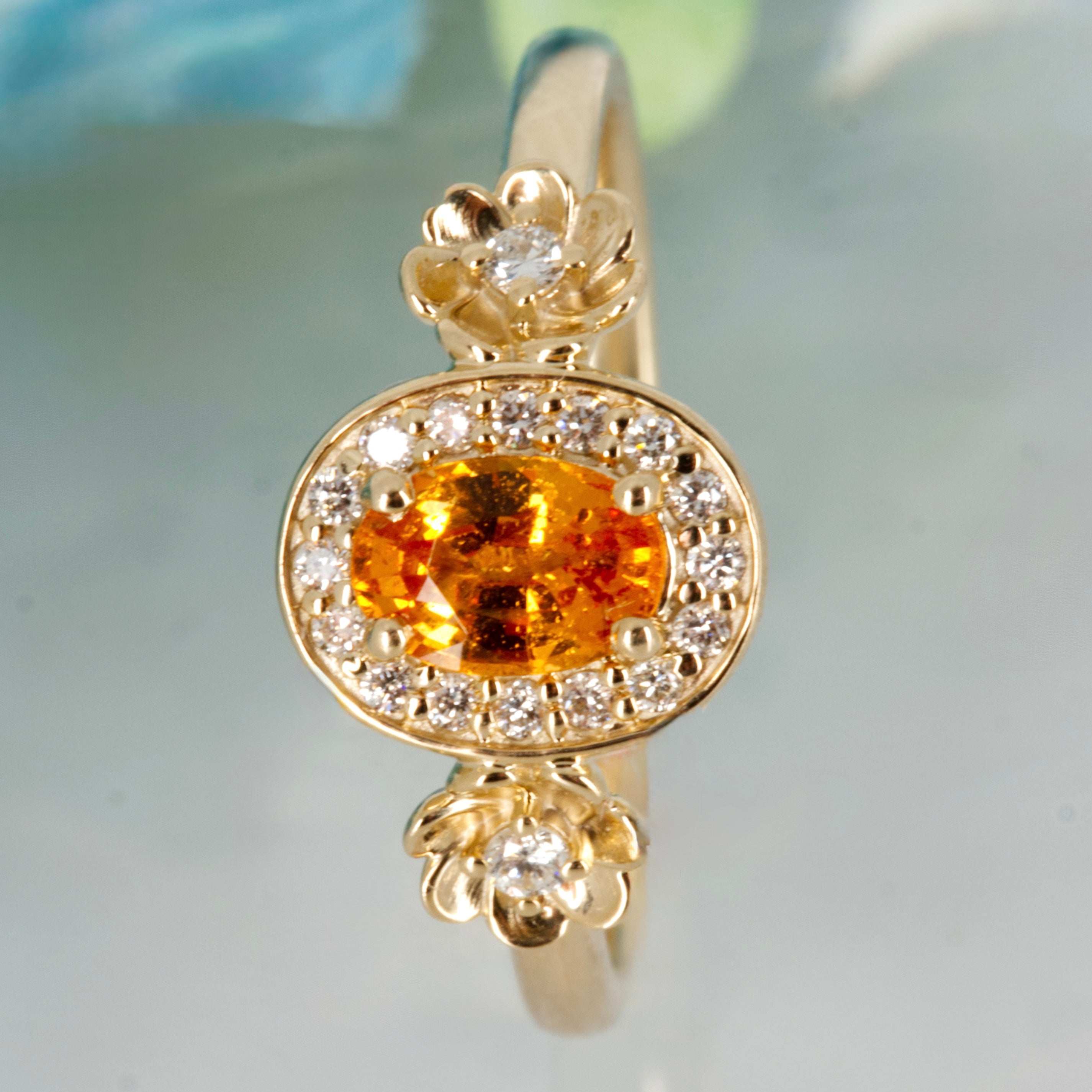 9ct Yellow Gold Oval Cut Spessartite Garnet & Round Brilliant Cut Diamond Halo Cluster Ring