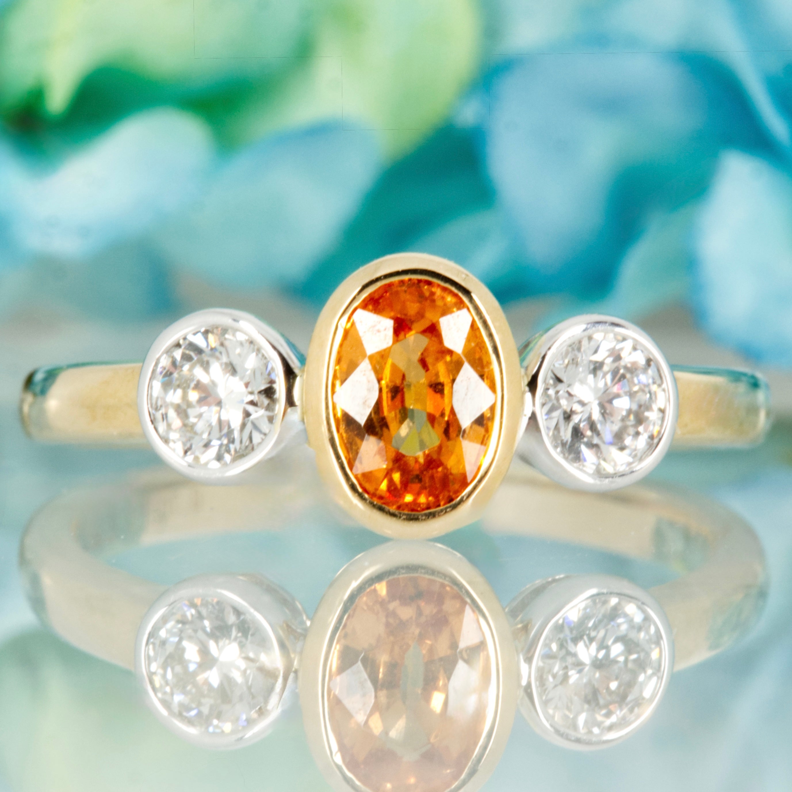 9ct Yellow Gold Oval Cut Mandarin Garnet & Round Brilliant Cut Diamond Trilogy Ring