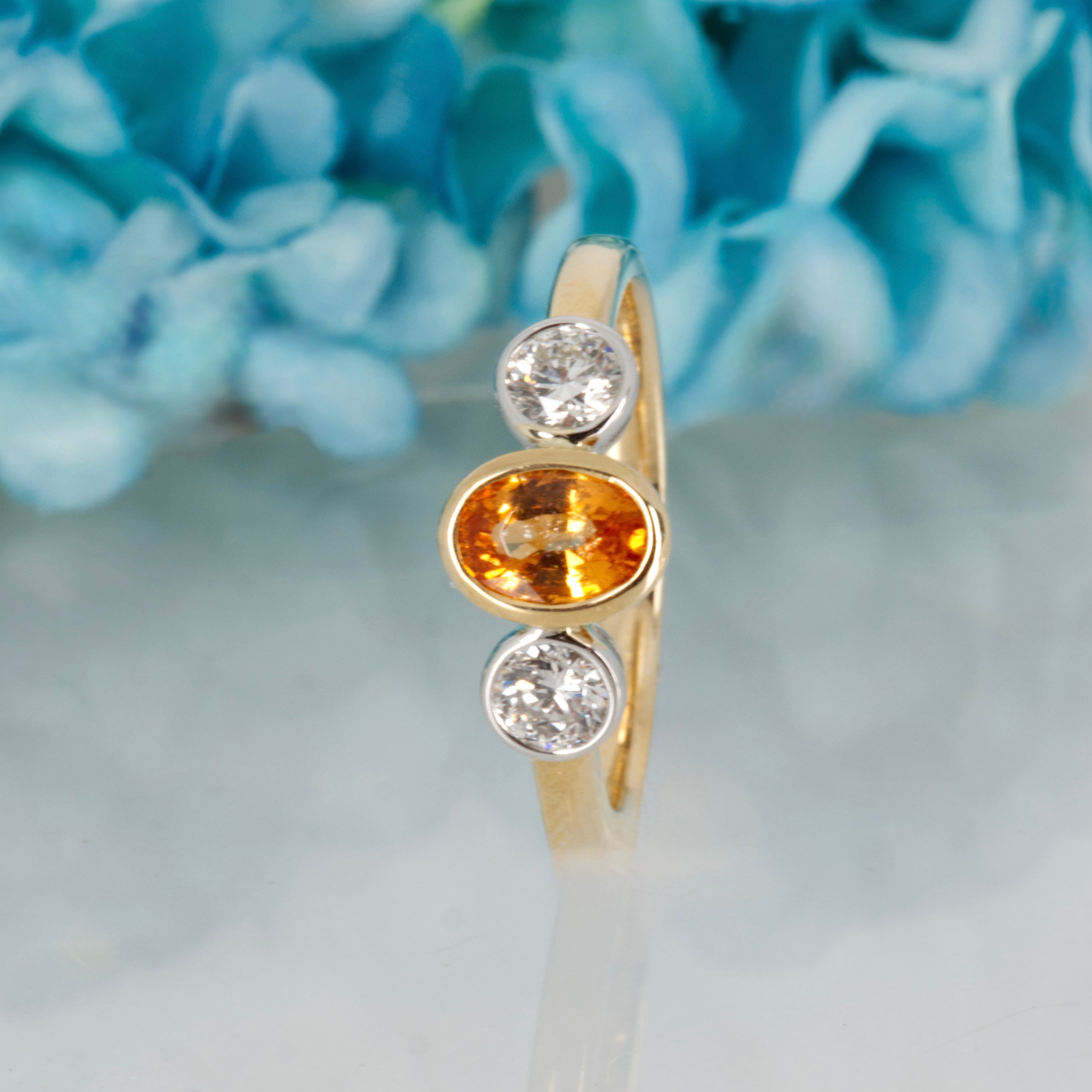 9ct Yellow Gold Oval Cut Mandarin Garnet & Round Brilliant Cut Diamond Trilogy Ring