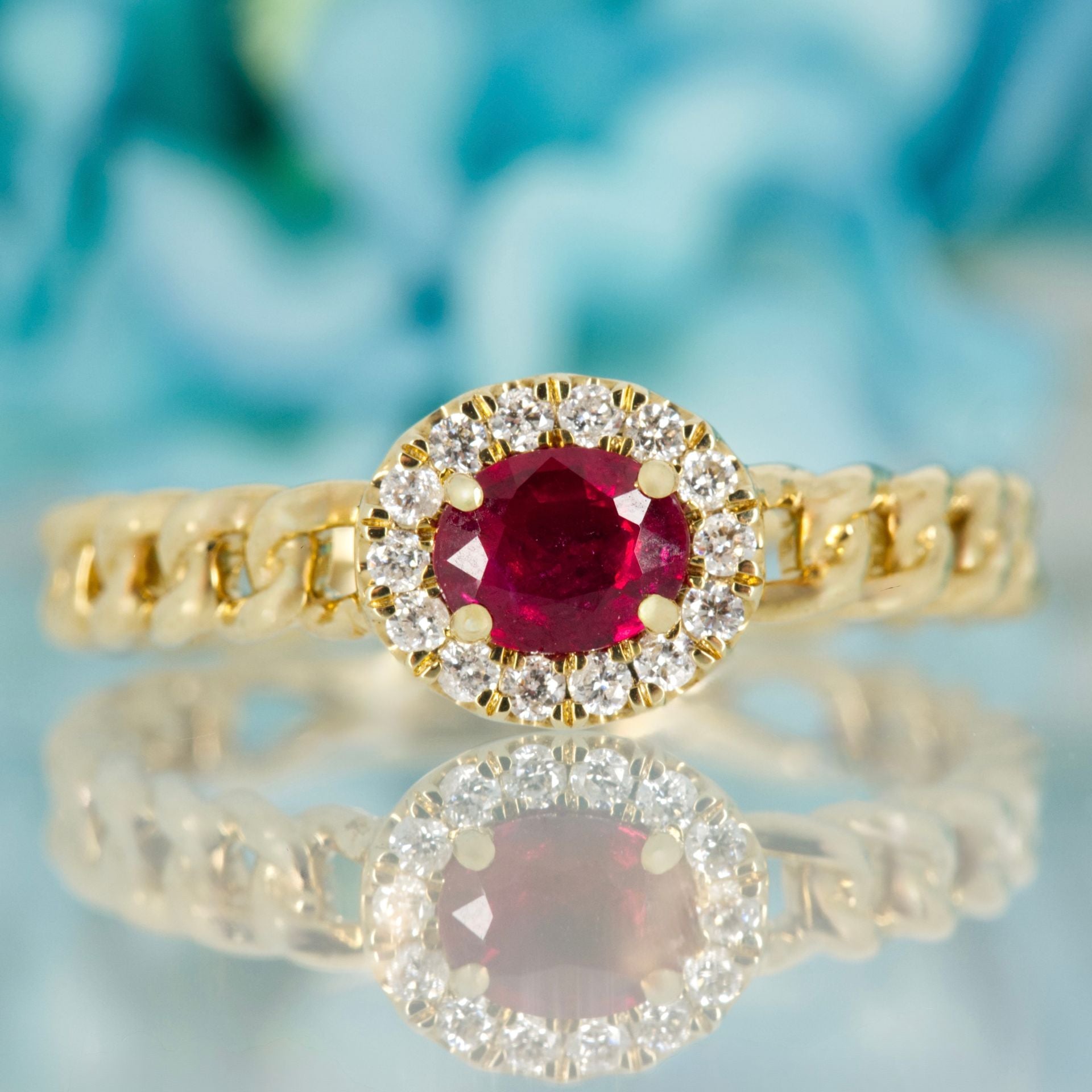 9ct Yellow Gold Oval Cut Ruby & Round Brilliant Cut Diamond Horizontal Halo Cluster Ring