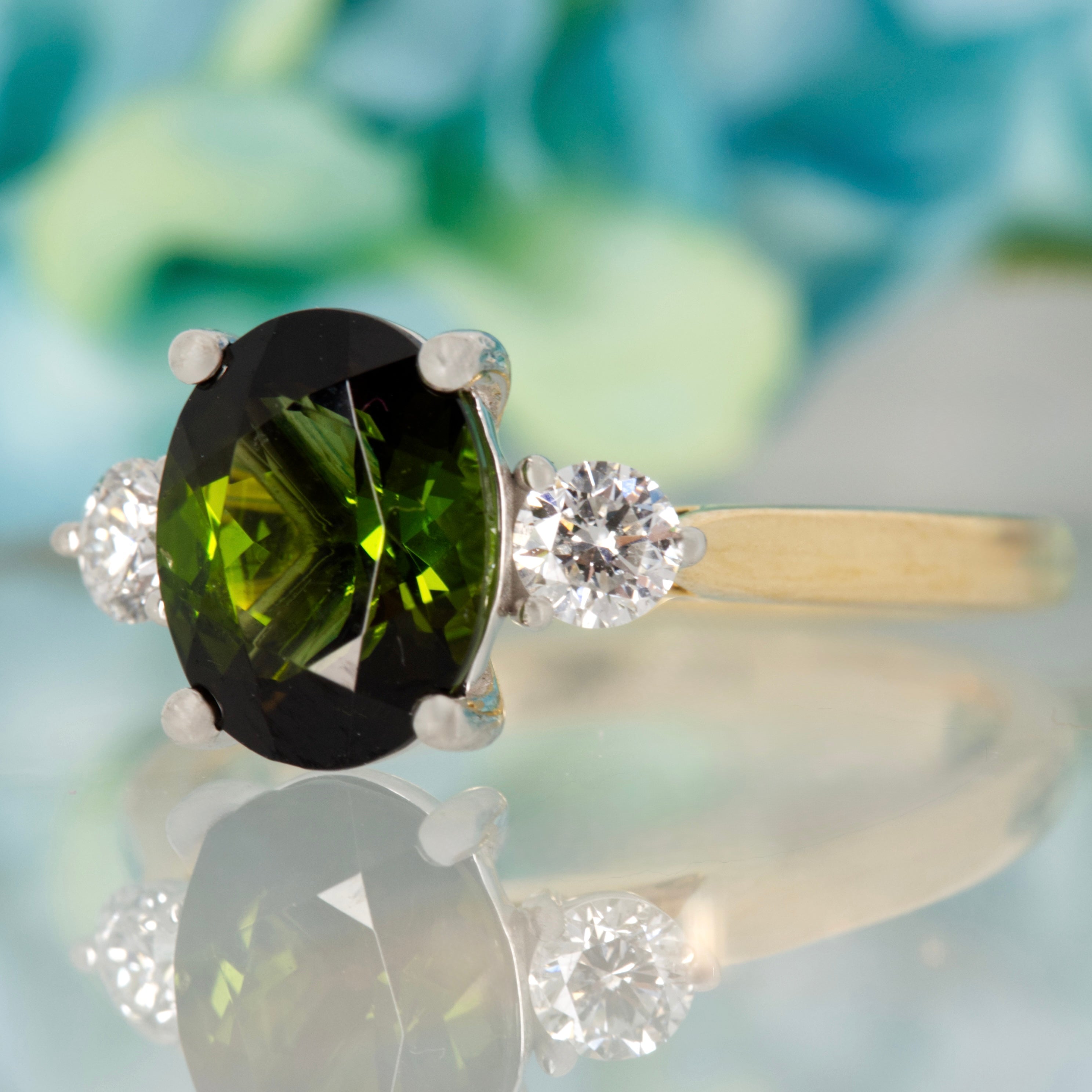 18ct Yellow Gold & Platinum Oval Cut Green Tourmaline & Round Brilliant Cut Diamond Trilogy Ring