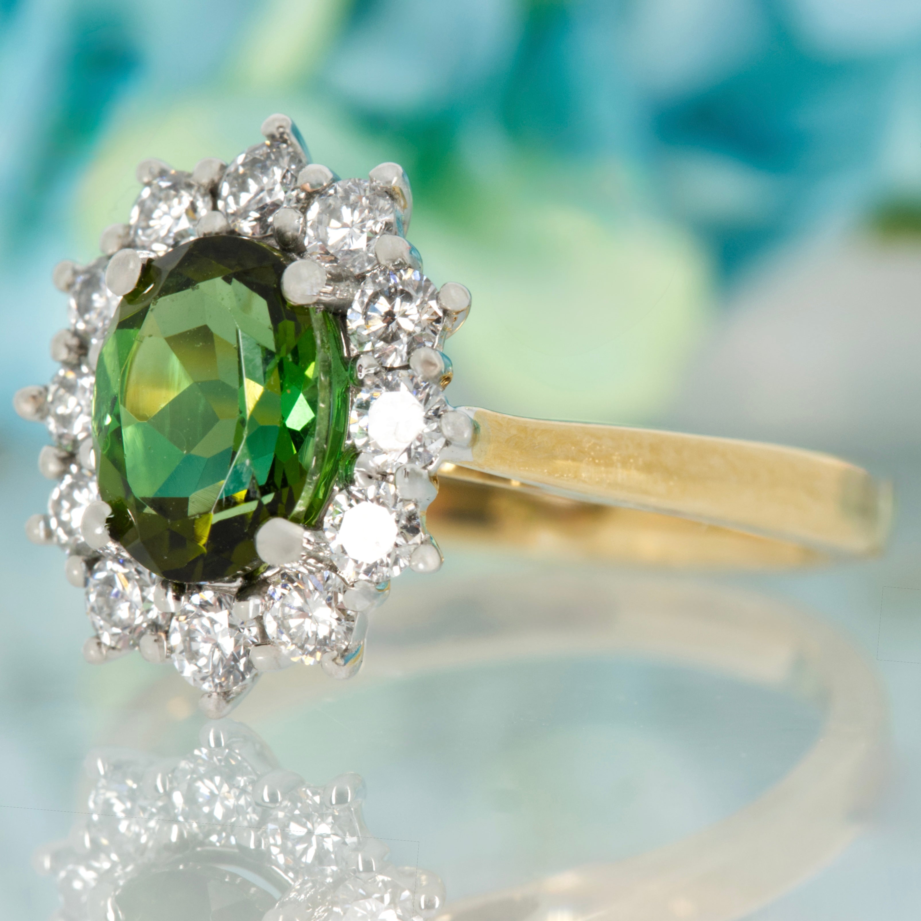 18ct Yellow Gold & Platinum Oval Cut Green Tourmaline & Round Brilliant Cut Diamond Cluster Ring