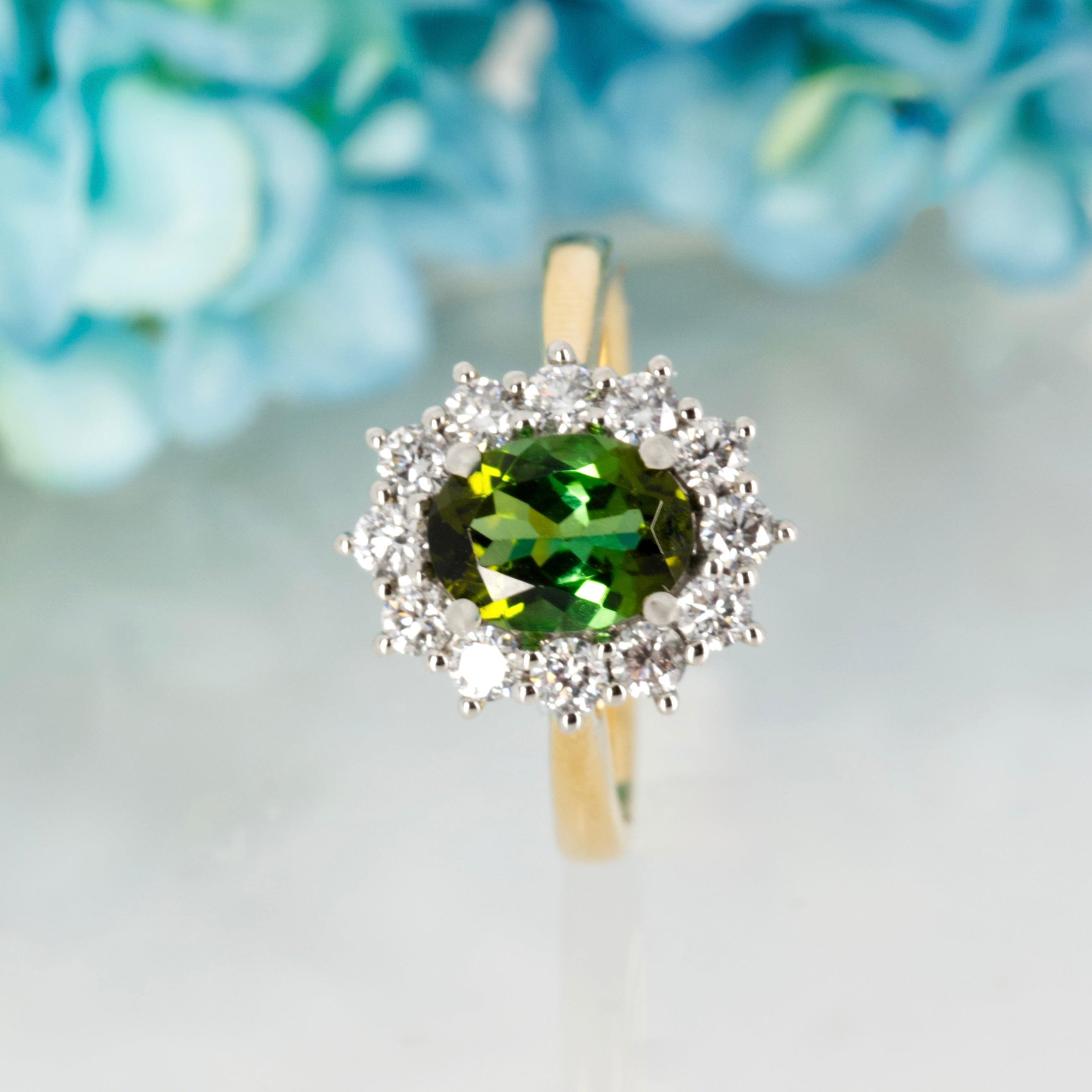 18ct Yellow Gold & Platinum Oval Cut Green Tourmaline & Round Brilliant Cut Diamond Cluster Ring