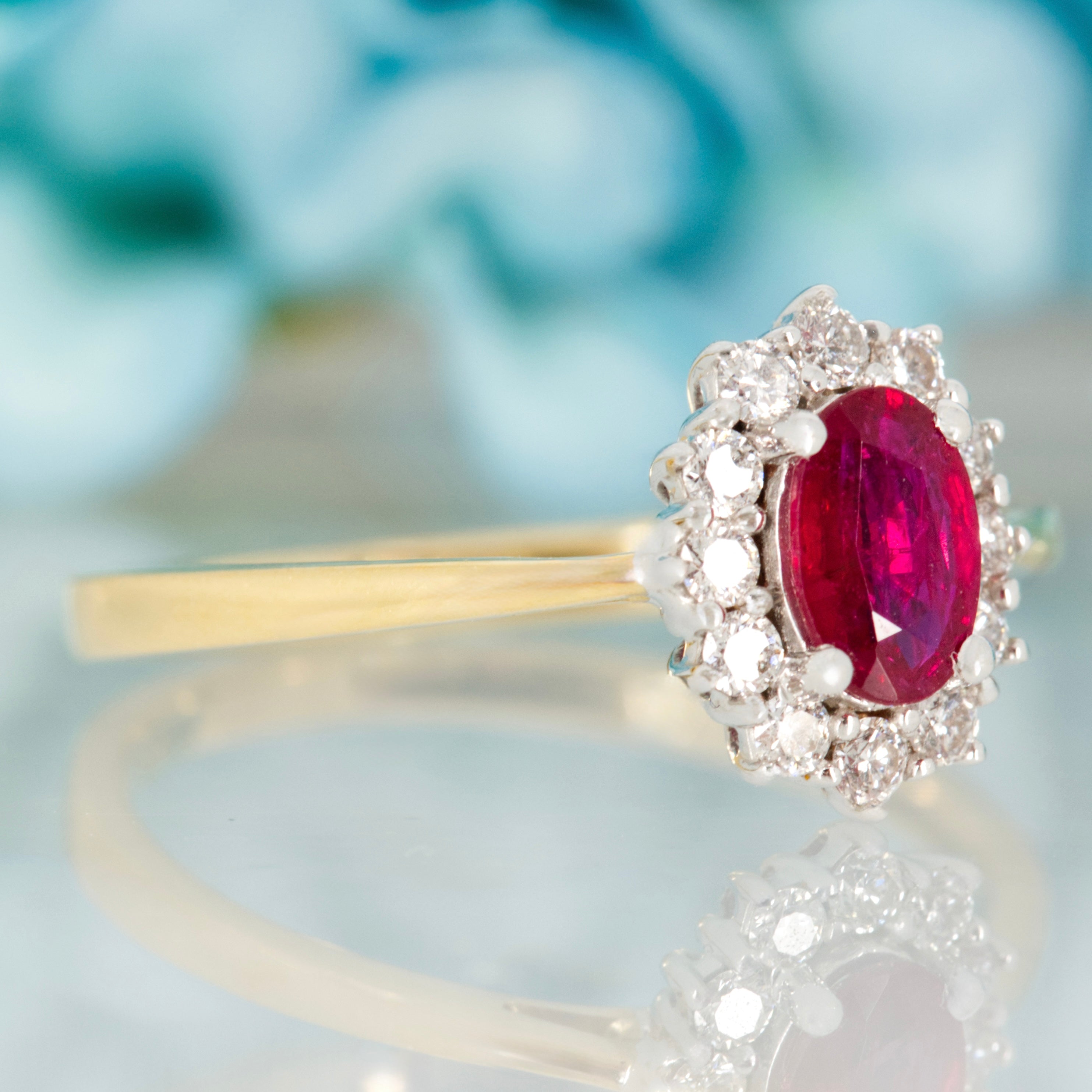 18ct Yellow Gold Oval Cut Ruby & Round Brilliant Cut Diamond Cluster Ring