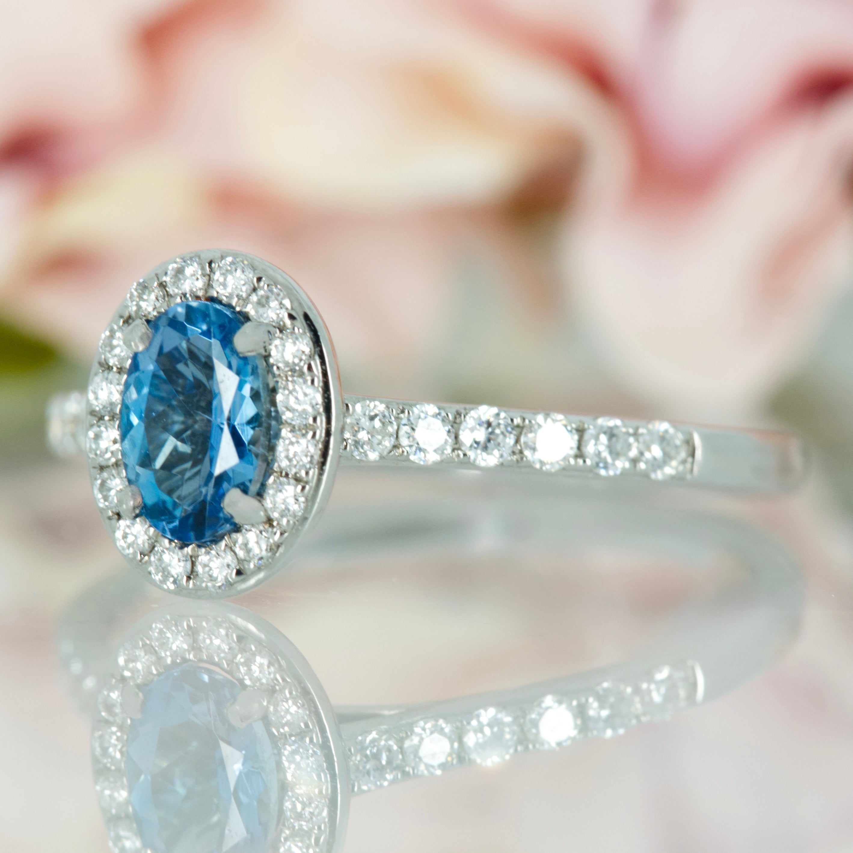18ct White Gold Oval Cut Aquamarine & Round Brilliant Cut Diamond Halo Cluster Ring