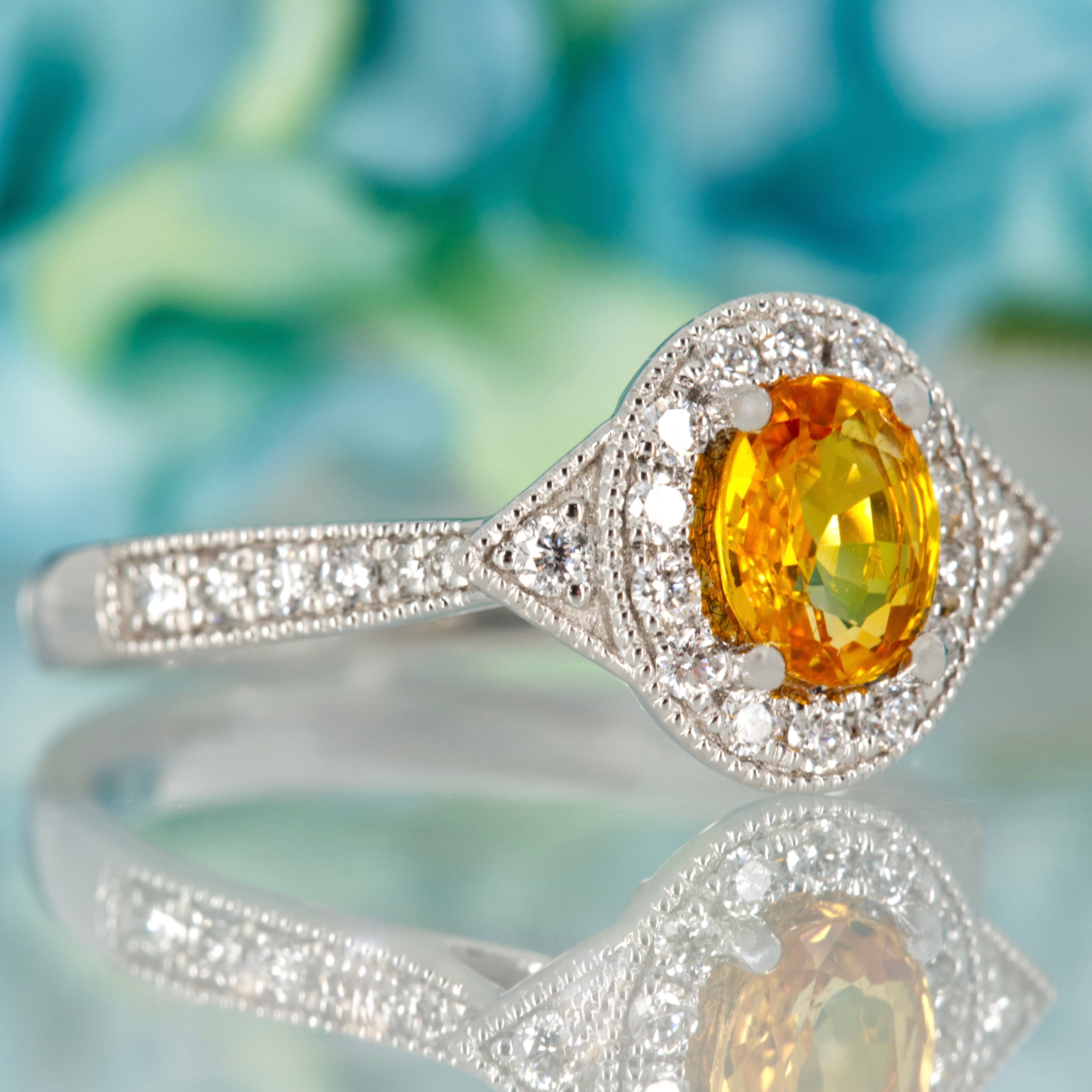 Platinum Oval Cut Yellow Sapphire & Round Brilliant Cut Diamond Halo Cluster Ring