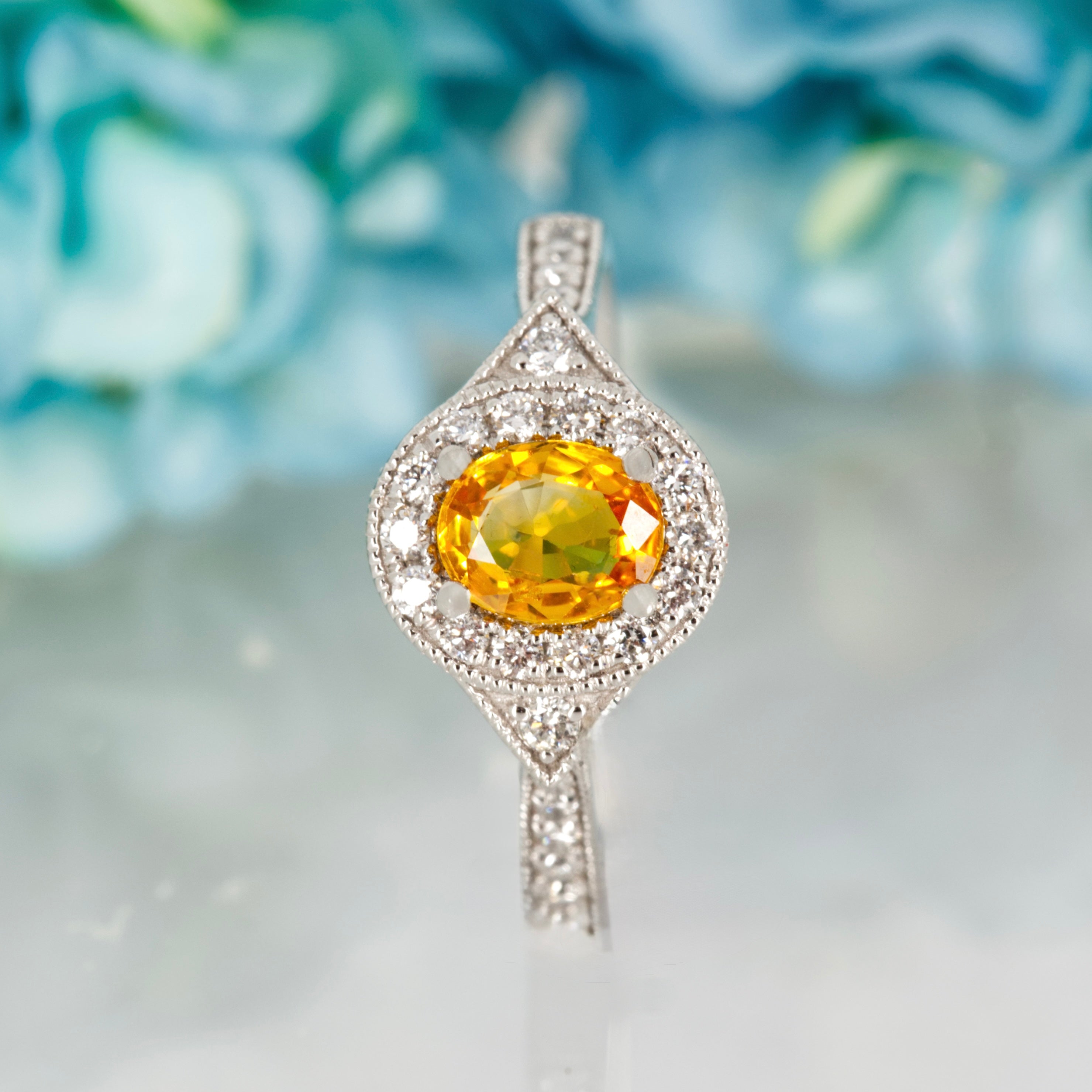 Platinum Oval Cut Yellow Sapphire & Round Brilliant Cut Diamond Halo Cluster Ring