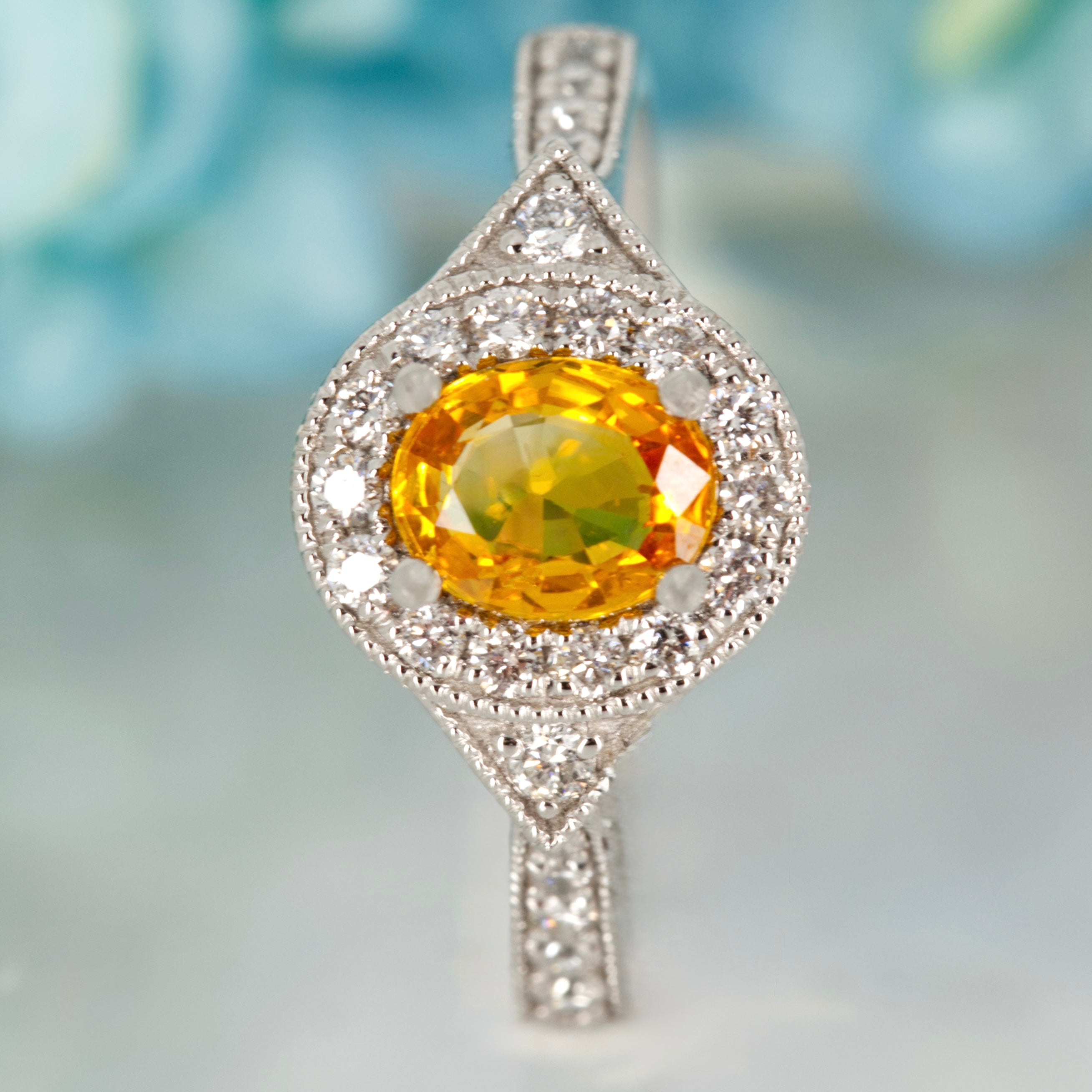 Platinum Oval Cut Yellow Sapphire & Round Brilliant Cut Diamond Halo Cluster Ring