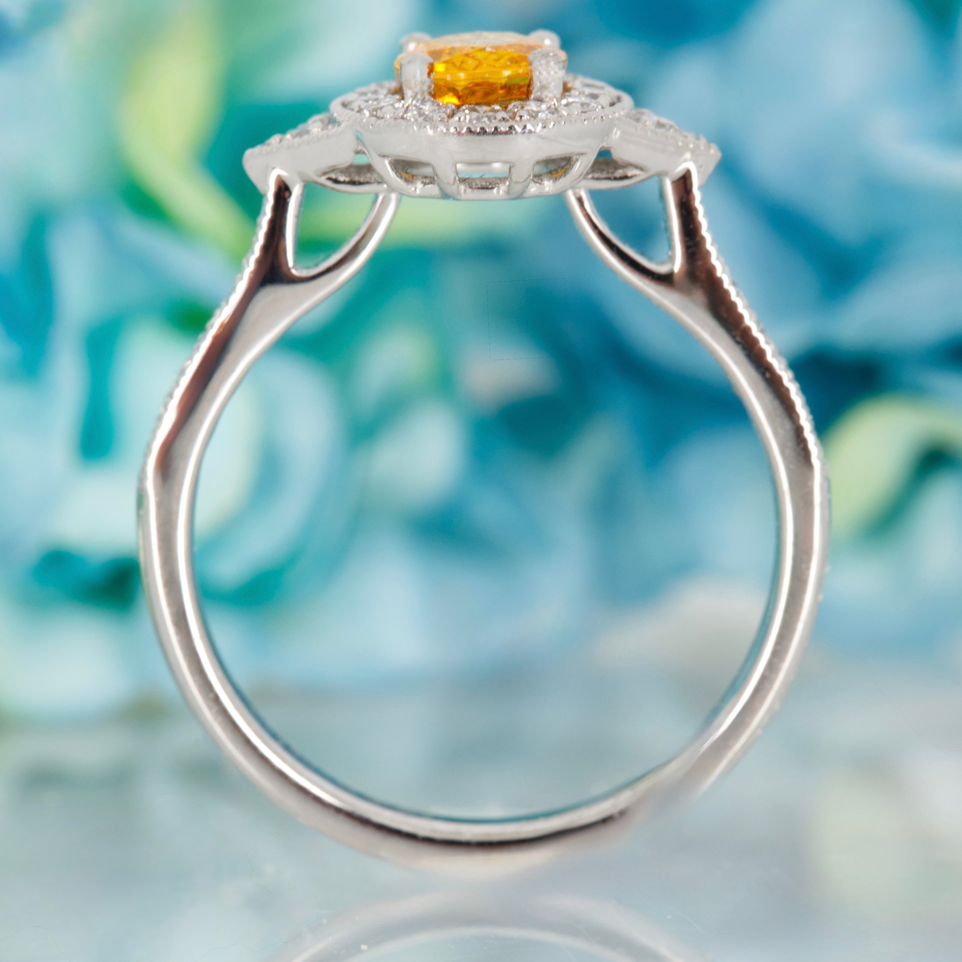 Platinum Oval Cut Yellow Sapphire & Round Brilliant Cut Diamond Halo Cluster Ring