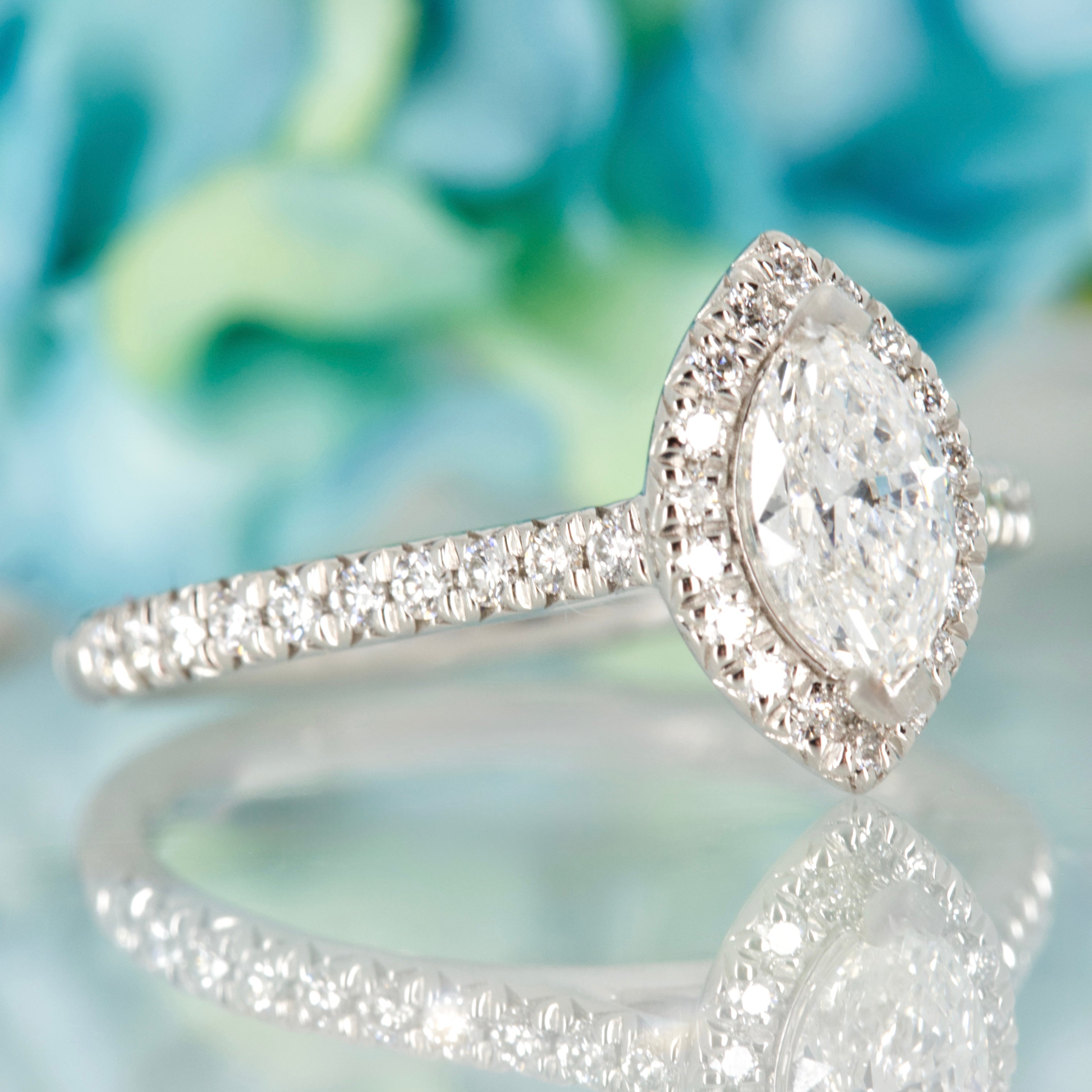 Platinum GIA Certified Marquise Cut Diamond & Round Brilliant Cut Diamond Halo Cluster Ring