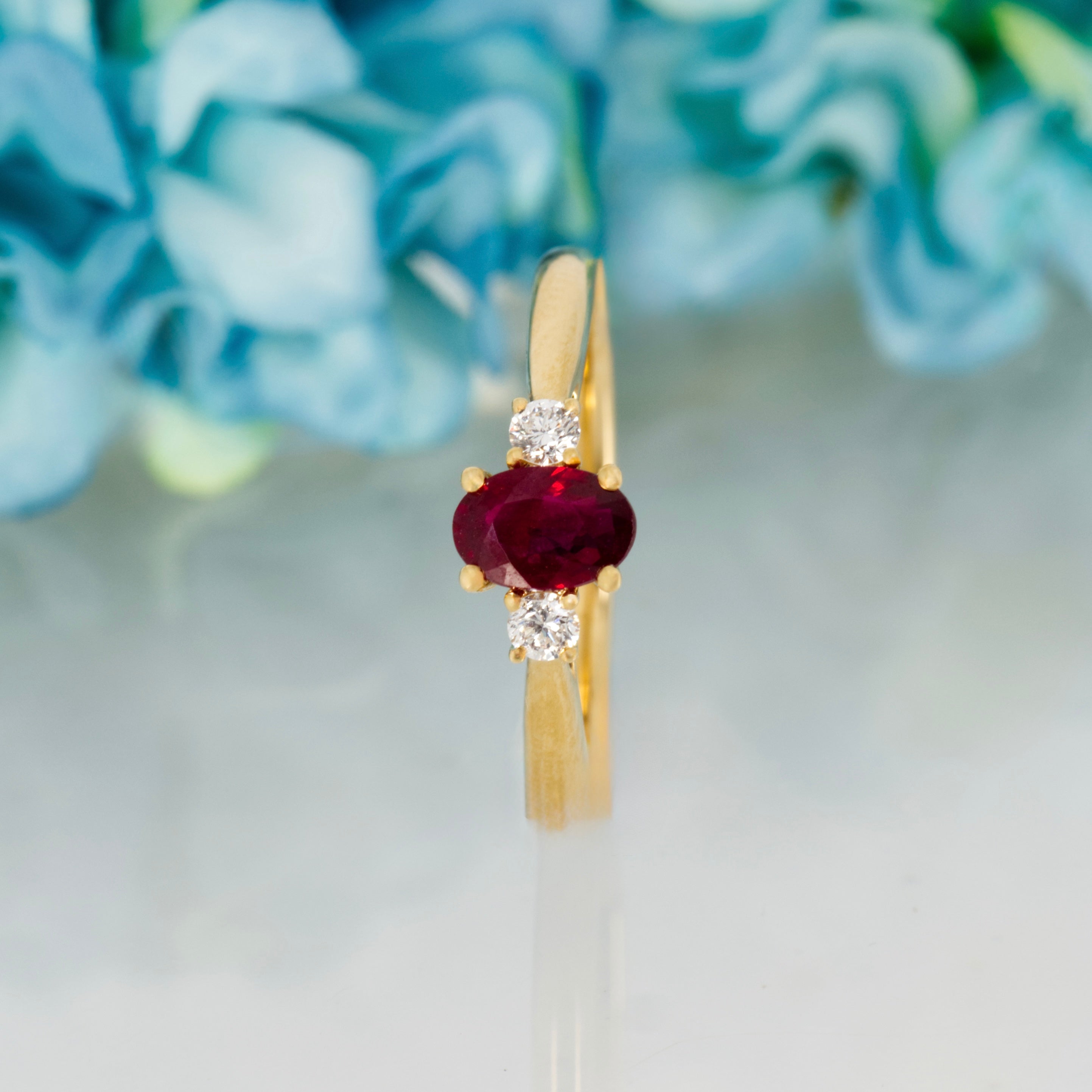 18ct Yellow Gold Oval Cut Ruby & Round Brilliant Cut Diamond Trilogy Ring