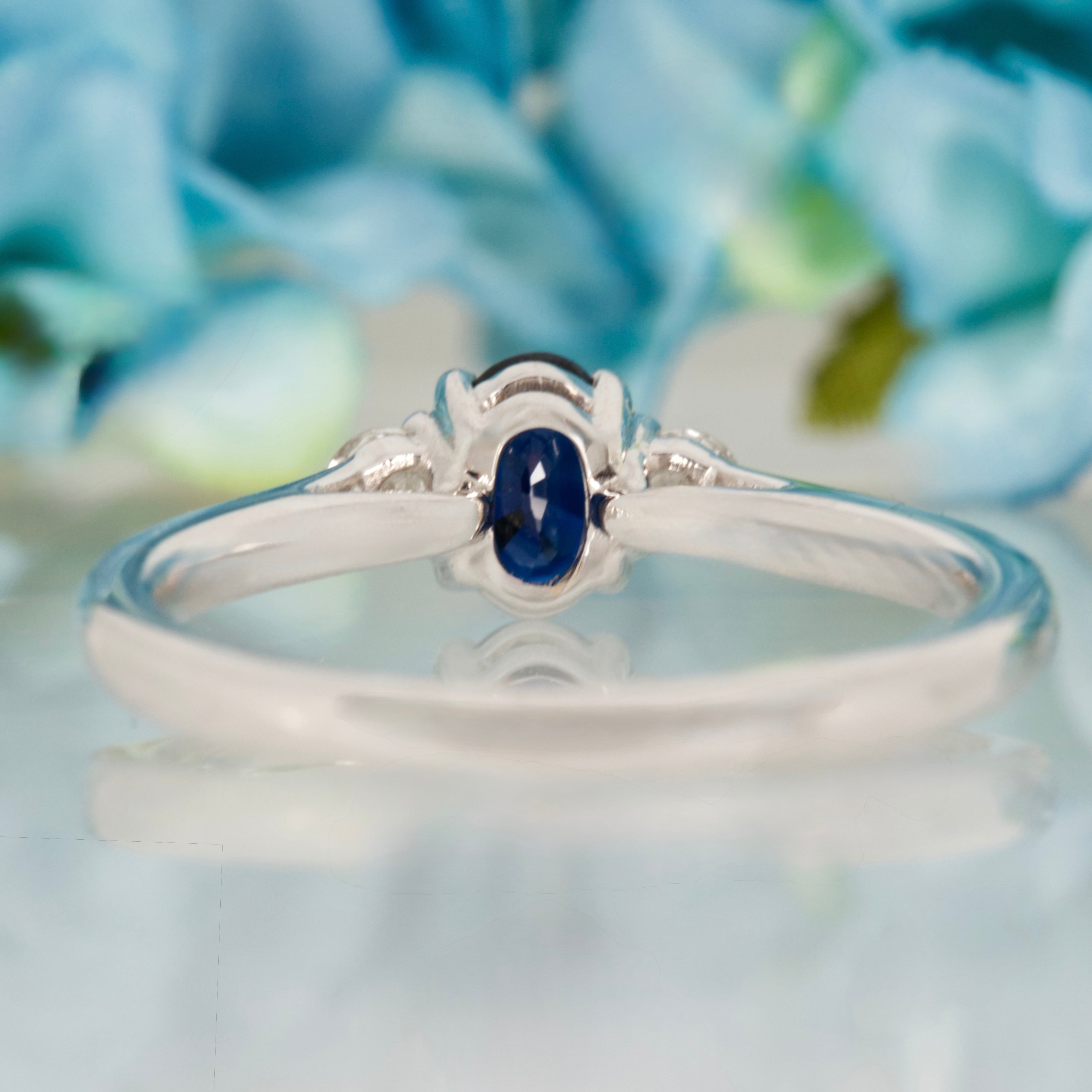 Platinum Oval Cut Sapphire & Round Brilliant Cut Diamond Trilogy Ring