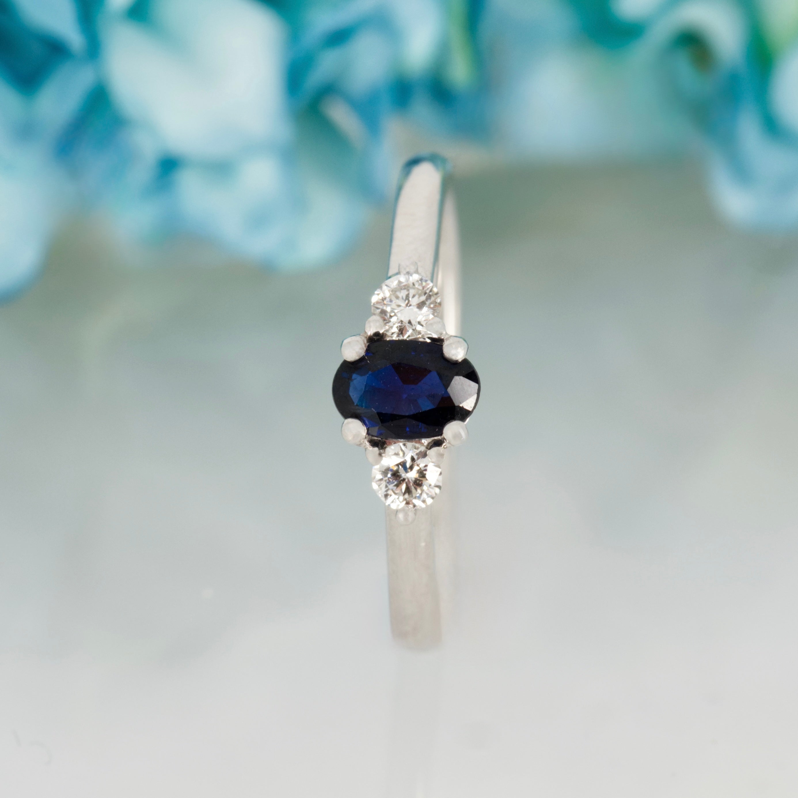 Platinum Oval Cut Sapphire & Round Brilliant Cut Diamond Trilogy Ring