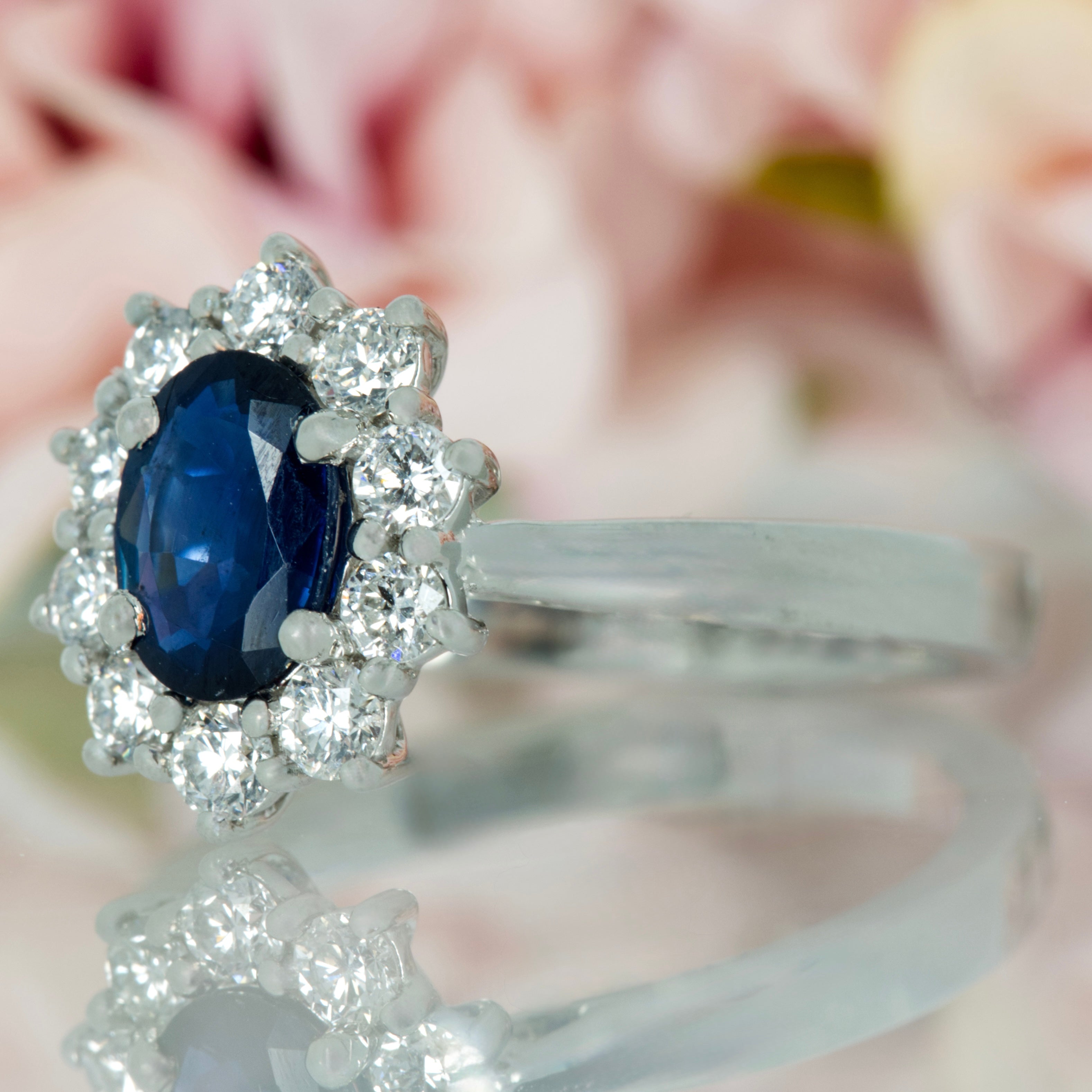 Platinum Oval Cut Sapphire & Round Brilliant Cut Diamond Cluster Ring