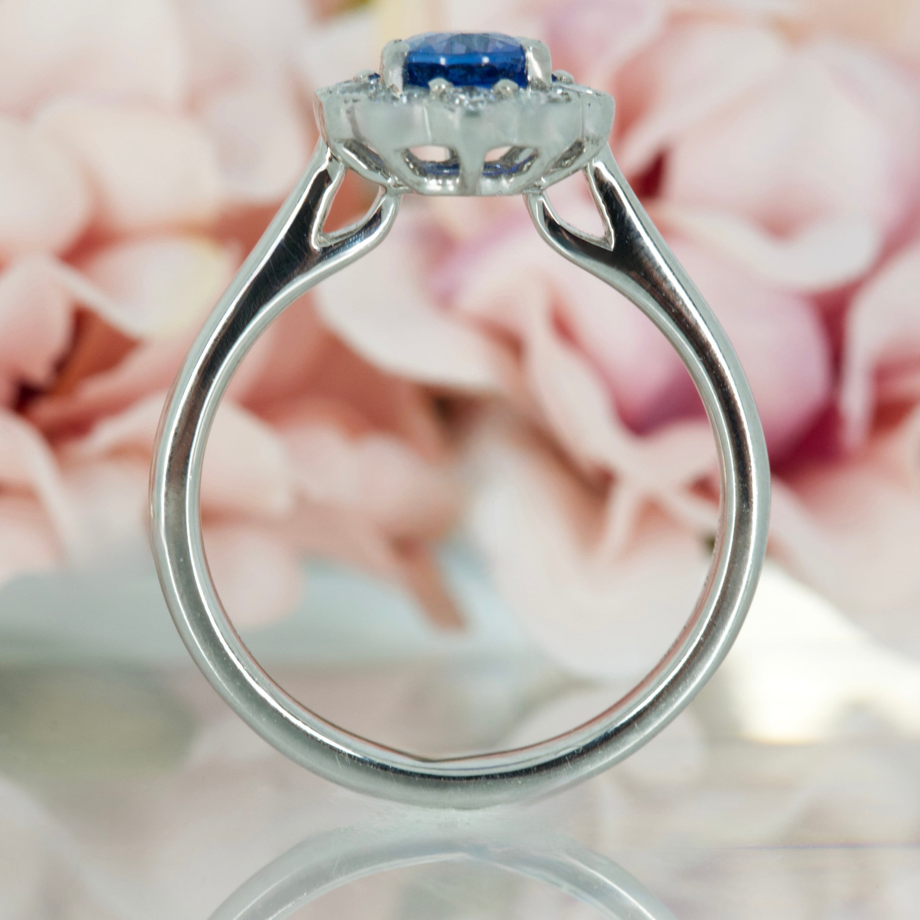Platinum Oval Cut Sapphire & Round Brilliant Cut Diamond Cluster Ring